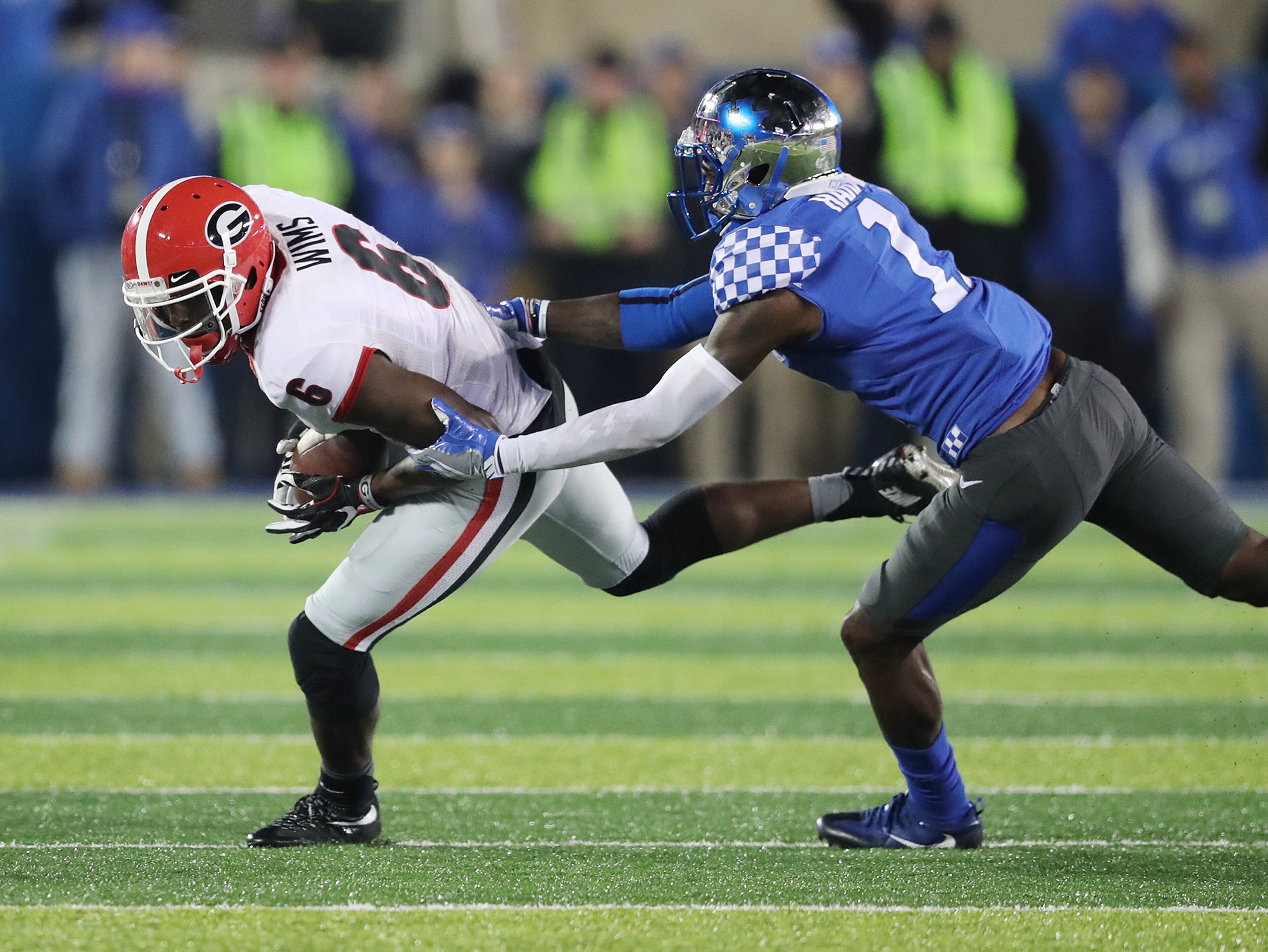 November 5, 2016, LEXINGTON: Georgia wide receiver Javon Wims makes a first down catch against a Kentucky defender on a touchdown drive during the fourth quarter of an NCAA college football game on Saturday, Nov. 5, 2016, in Lexington. Curtis Compton /ccompton@ajc.com