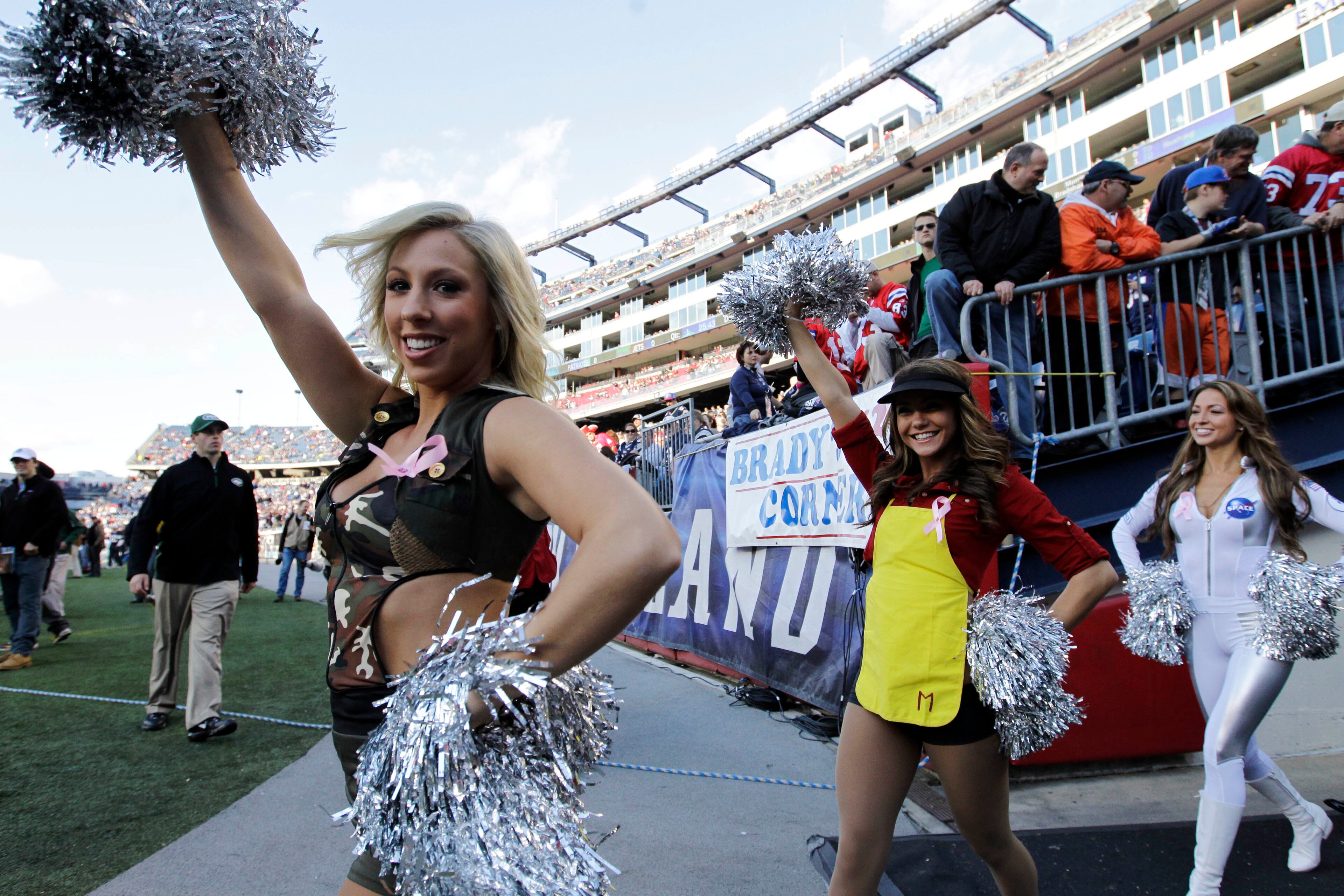 New England Patriots cheerleaders, dressed in Halloween costumes, take the field before an NFL football game between the New England Patriots and the New York Jets in Foxborough, Mass., Sunday, Oct. 21, 2012. (AP Photo/Elise Amendola)