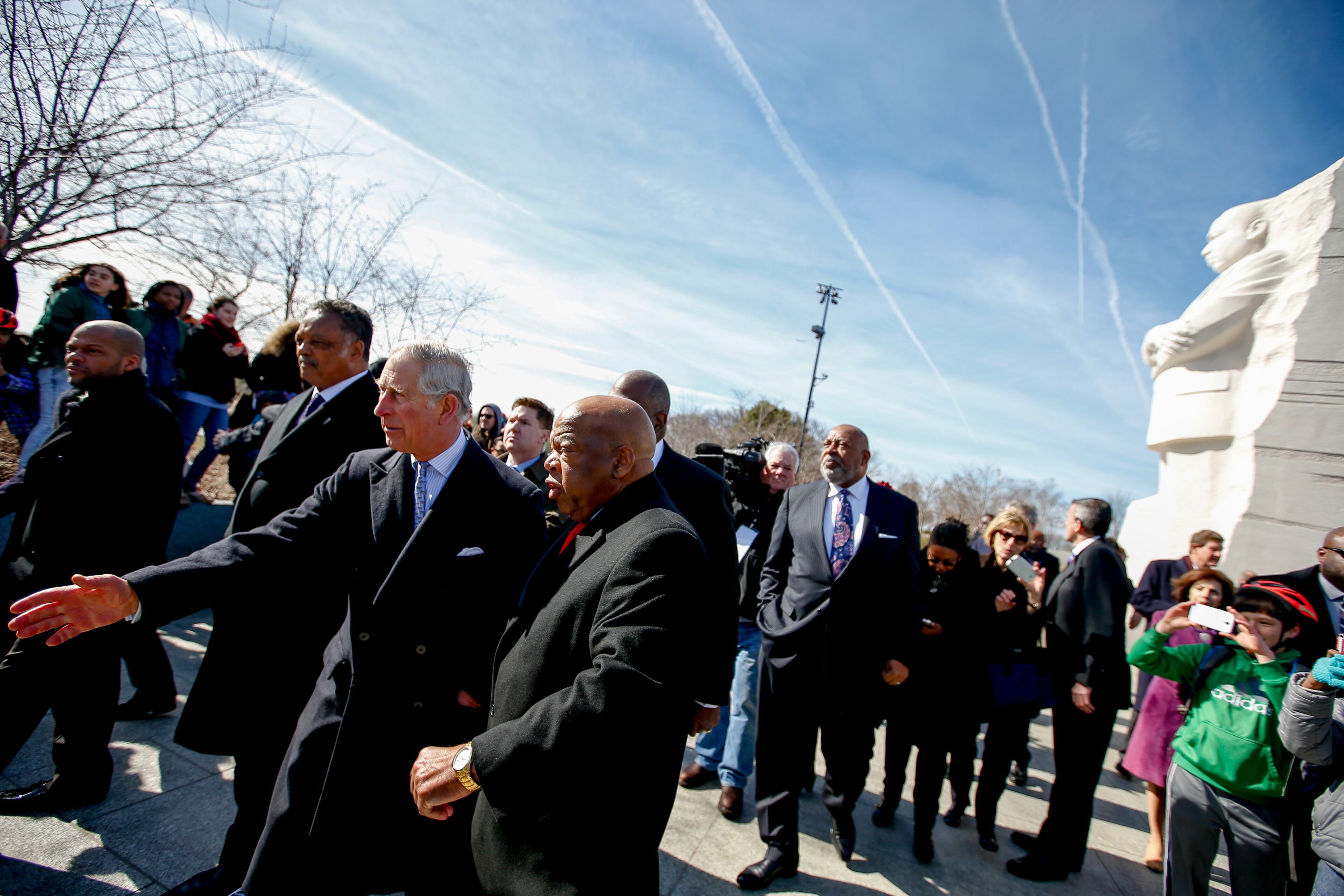 Britain�s Prince Charles, second from left, shakes hands with people as he and Camilla, the Duchess of Cornwall tour the Martin Luther King, Jr. Memorial with Rev. Jesse Jackson, second from left, and Rep. John Lewis, D-Ga., center left, Wednesday, March 18, 2015, in Washington. The royal couple are visiting cultural and educational sites in the Washington region. (AP Photo/Andrew Harnik)