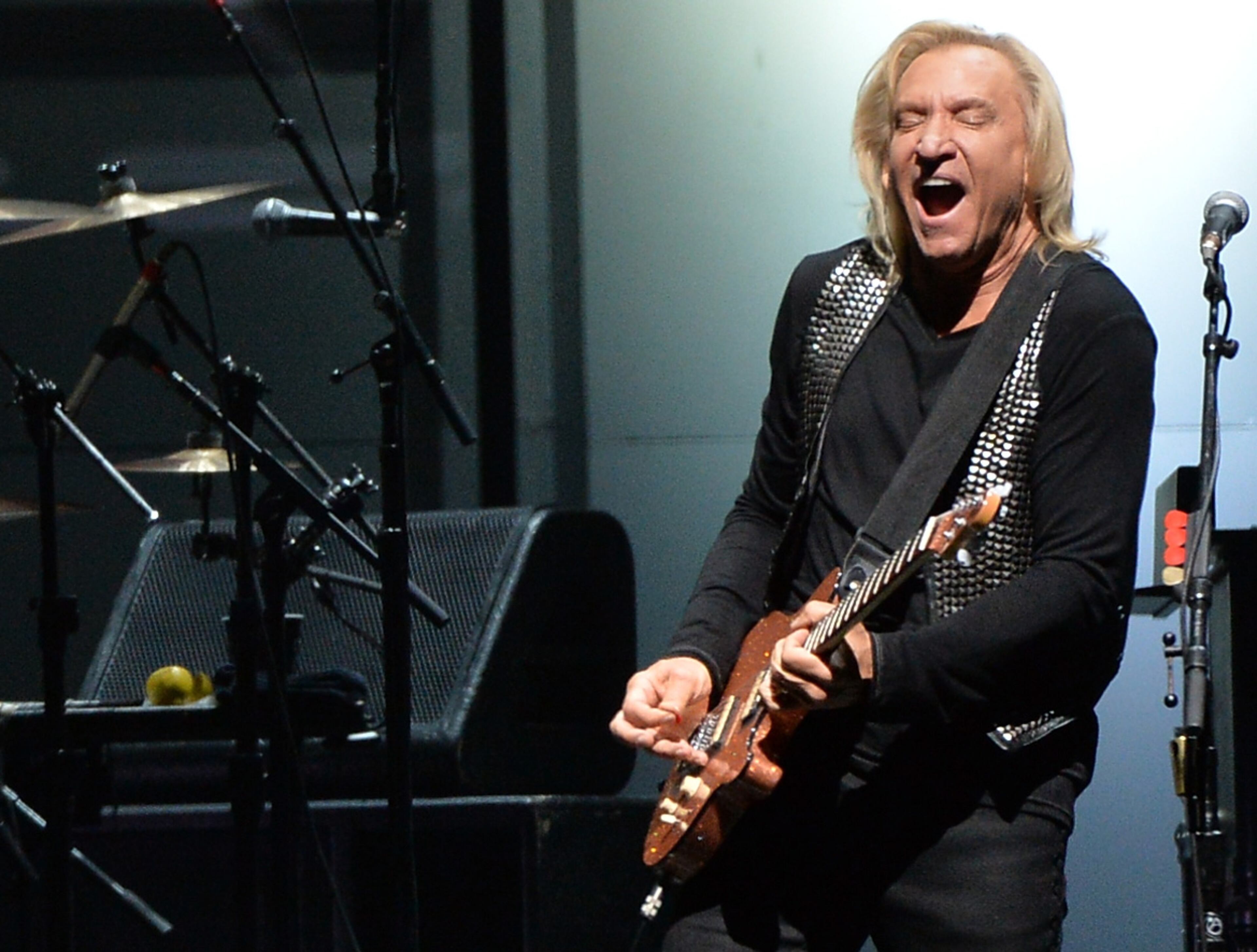 NASHVILLE, TN - OCTOBER 16: Joe Walsh of the Eagles performs at the Bridgestone Arena on October 16, 2013 in Nashville, Tennessee. (Photo by Rick Diamond/Getty Images)