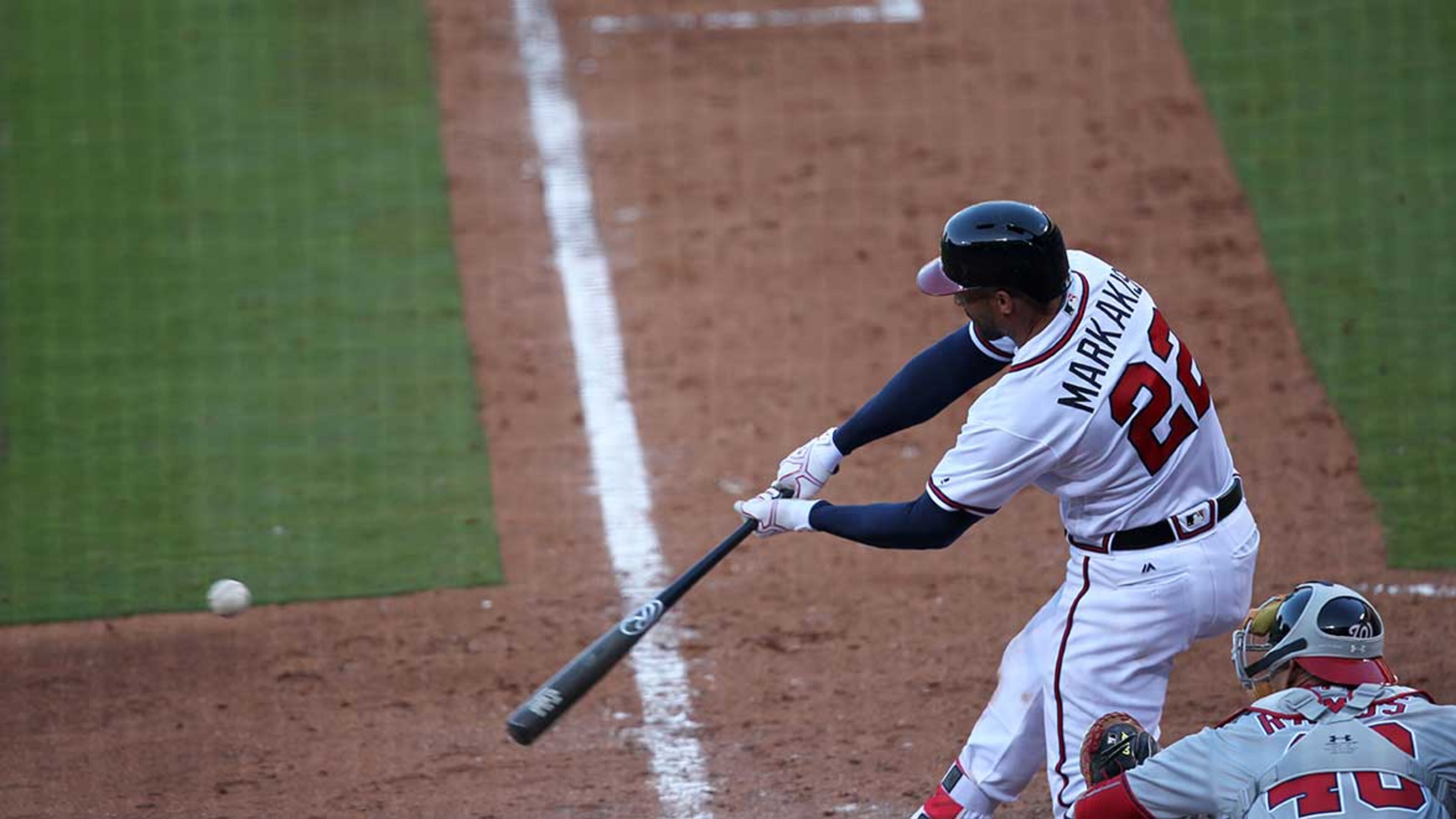 Nick Markakis (22) bats at Turner Field during the Opening Day game against the Nationals.