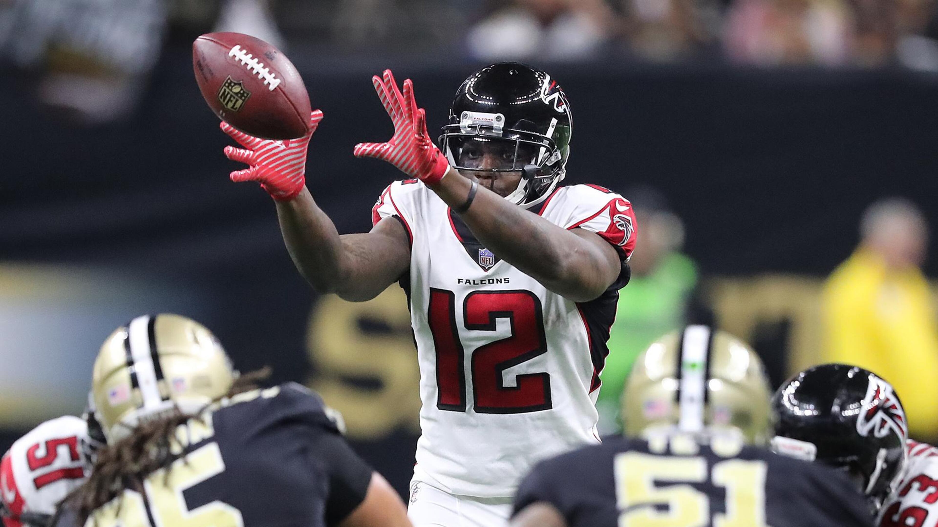 Falcons wide receiver Mohamed Sanu takes a snap at quarterback against the Saints during the second half in a NFL football game on Sunday, December 24, 2017, in New Orleans.