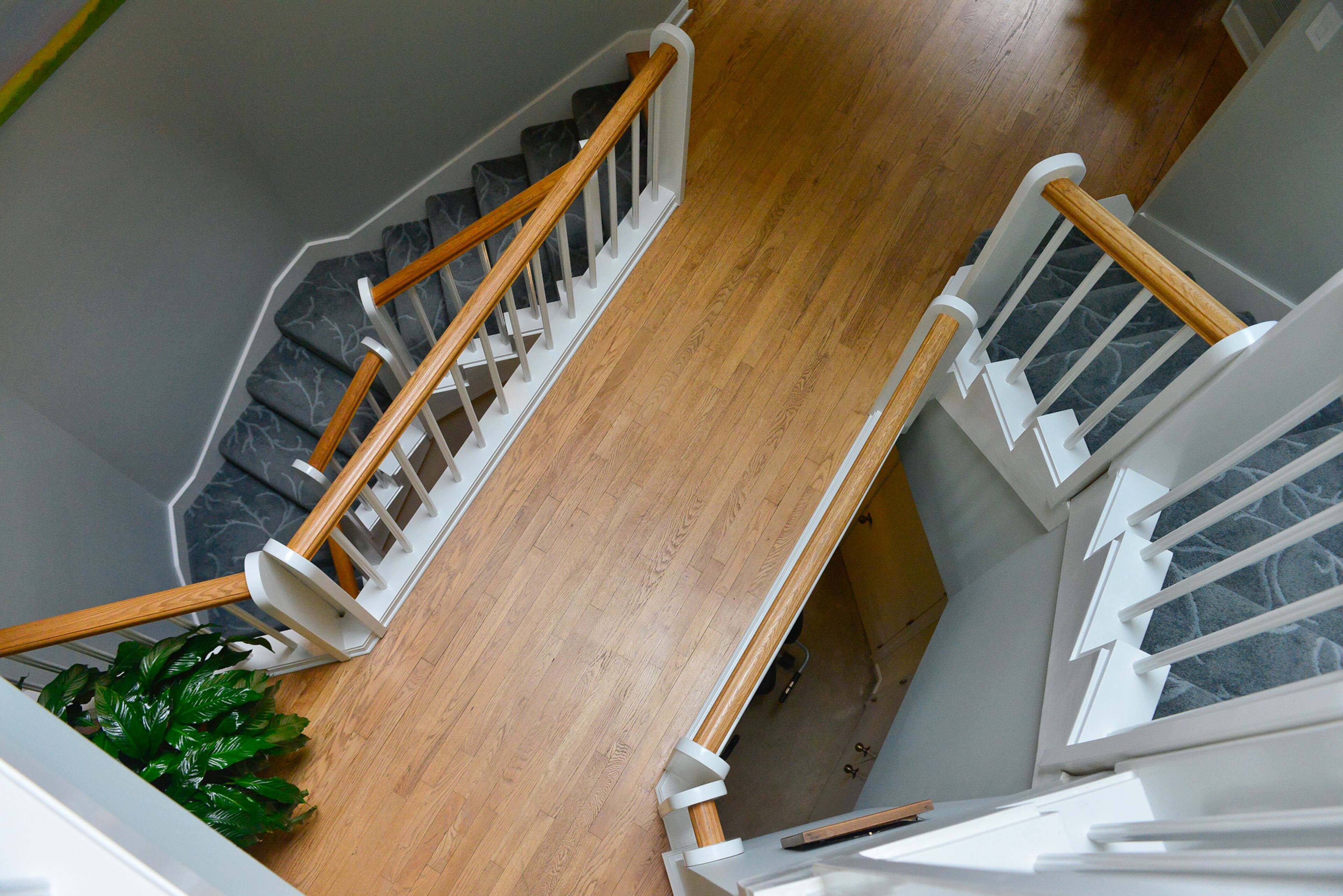 At the core of the Roswell home is a staircase that wraps around in an octagonal shape. On one floor, a bridge connects the entry to the living room. "It is fun to stand there and view the rooms and spaces, " says homeowner Judy Mozen.