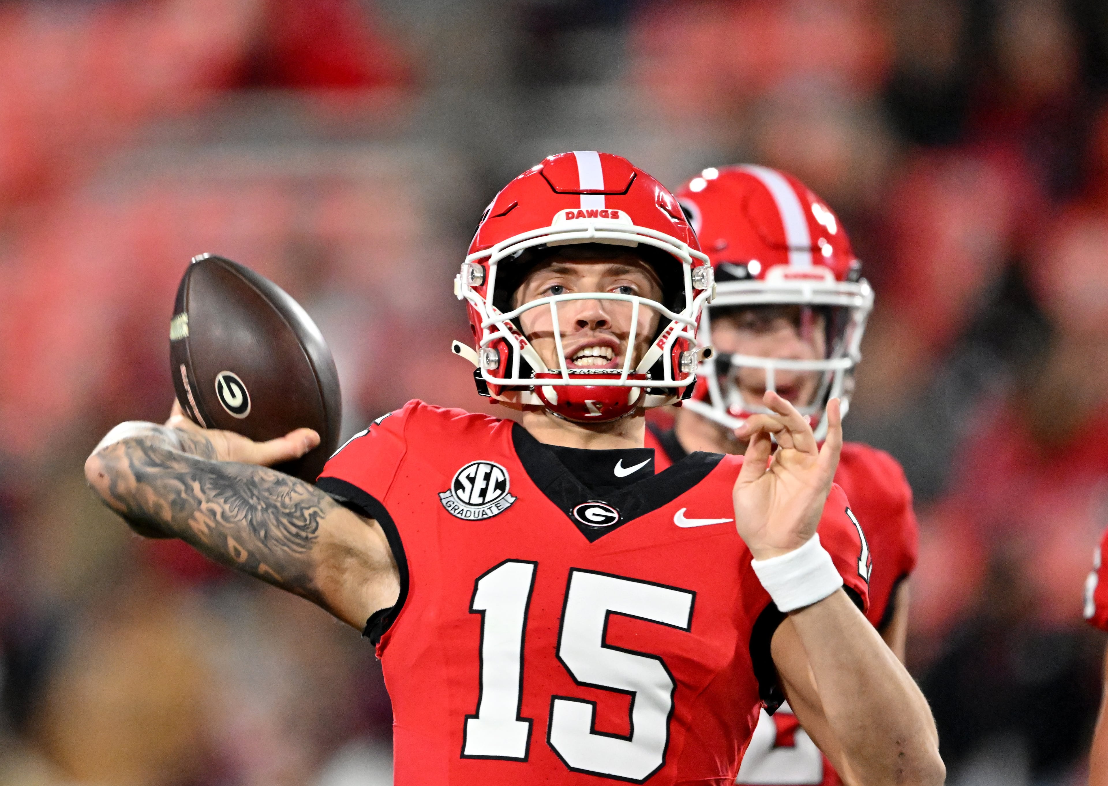 Georgia quarterback Carson Beck (15) throws a ball before an NCAA football game between Georgia and Georgia Tech at Sanford Stadium, Friday, November 29, 2024, in Athens. (Hyosub Shin / AJC)