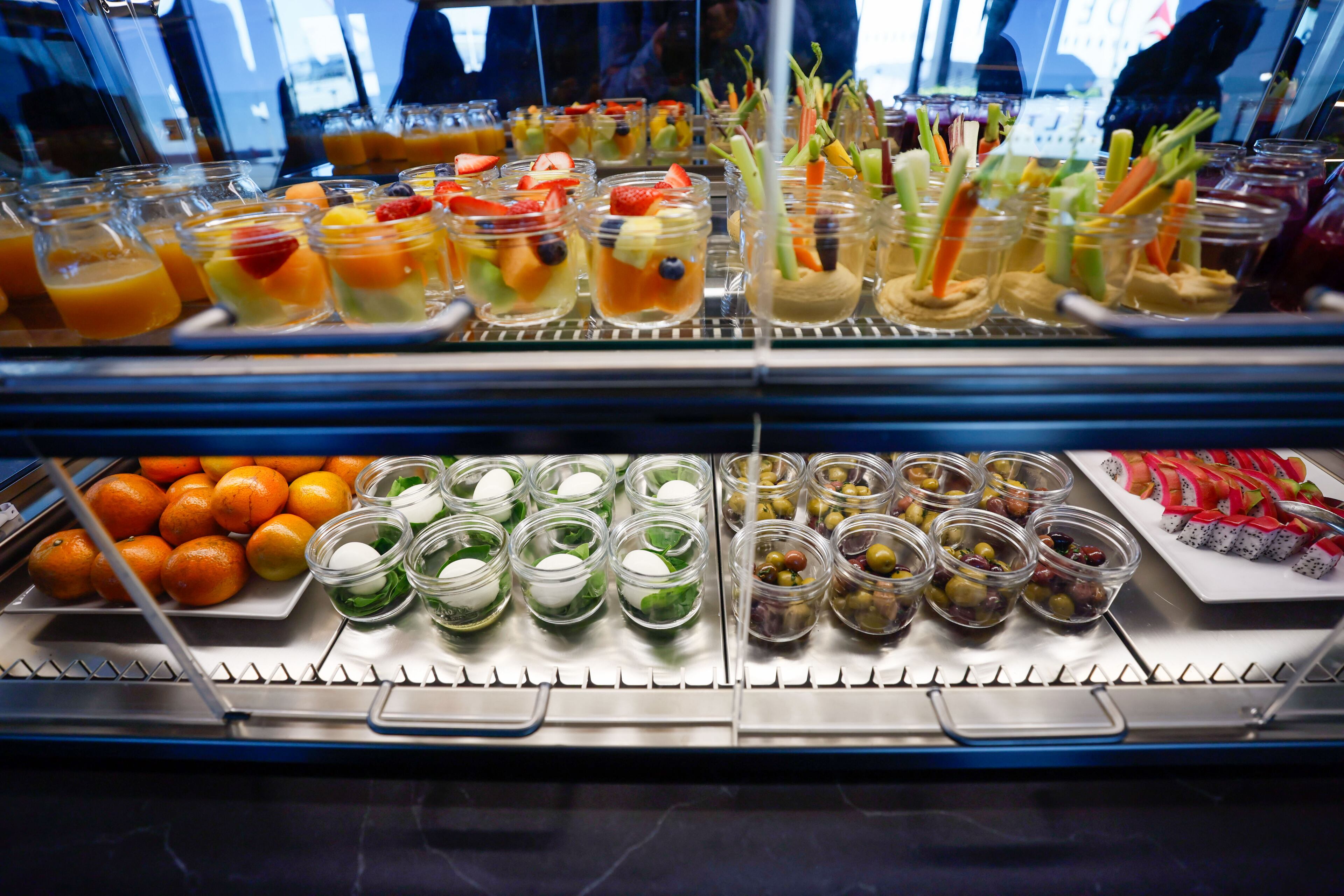 The Centurion Lounge at Hartsfield-Jackson International Airport has a food and beverage station with gluten free and vegan options, including protein bites, salads, smoothies, and immunity booster juice shots. Miguel Martinez /miguel.martinezjimenez@ajc.com