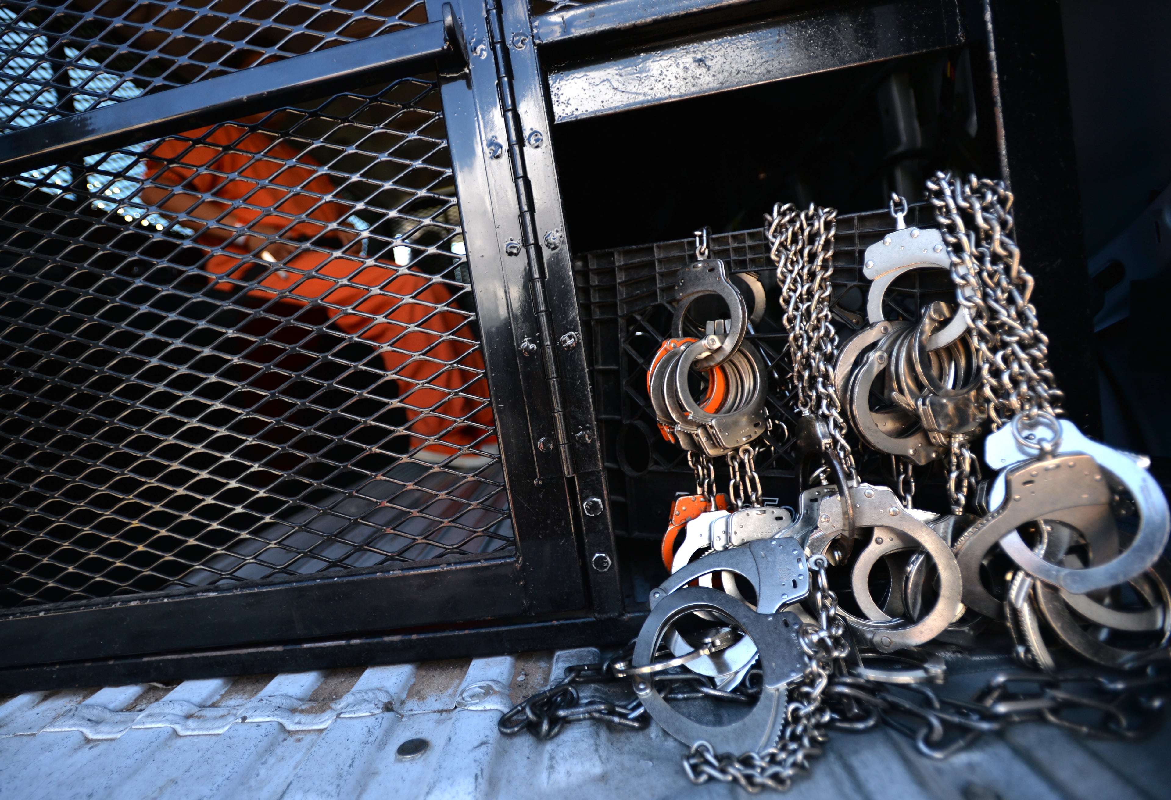 El Paso, Texas - A detainee waits inside a ICE vehicle before she is being transferred at the El Paso Processing Center in El Paso, Texas on Friday, September 27, 2013. This bustling border city is both a gateway for illegal immigrants and the last stop many see before they are deported. Before they are expelled from the U.S., many illegal immigrants are held at the El Paso Processing Center, a razor wire-rimmed detention facility next to the city airport. HYOSUB SHIN / HSHIN@AJC.COM