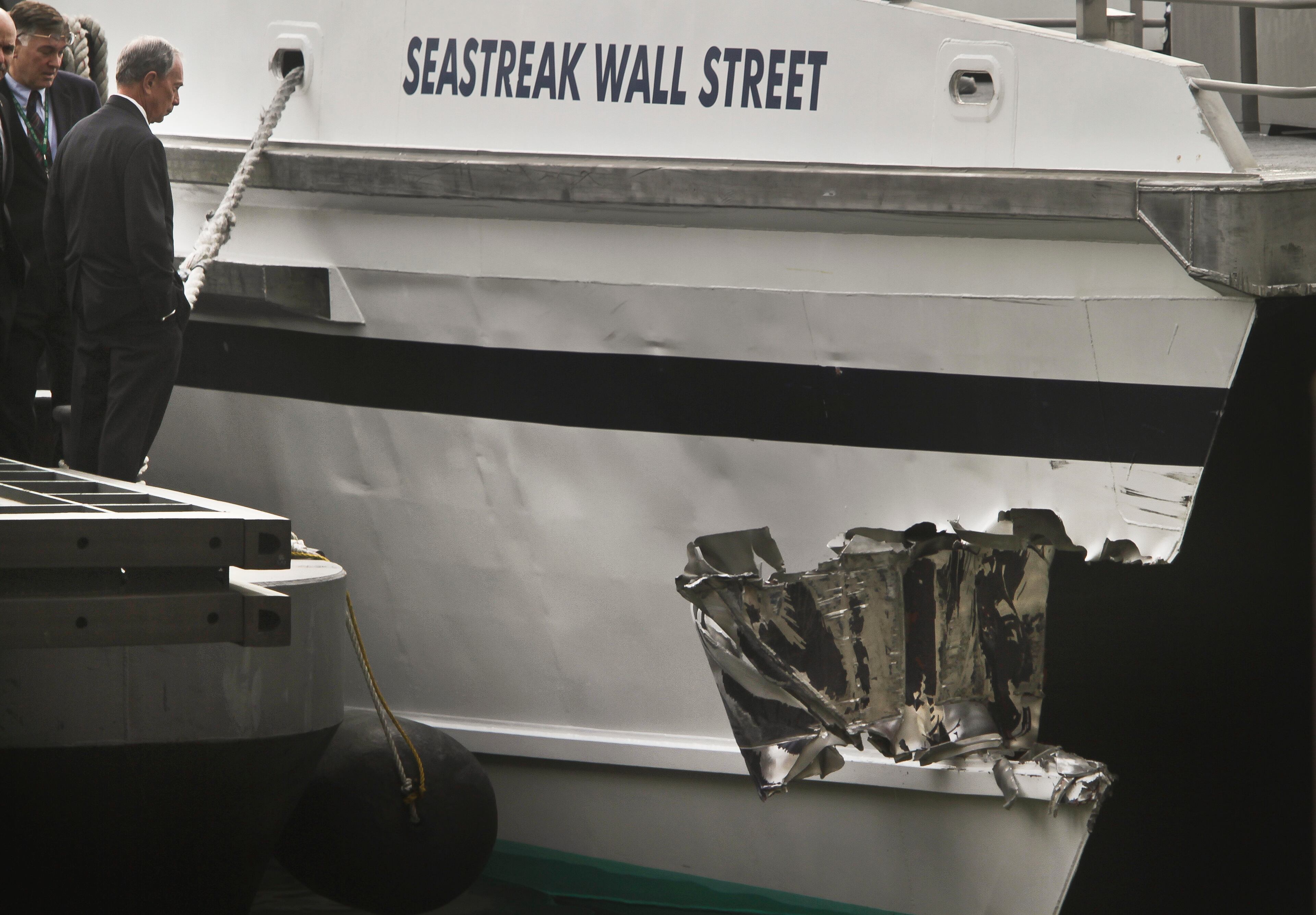 Mayor Michael Bloomberg surveys the damage to a passenger ferry after it crashed on Wednesday, Jan. 9, 2013 in New York. At least 50 people were injured, two critically, when a commuter ferry struck a dock in New York City's financial district, ripping open a right-side front corner.