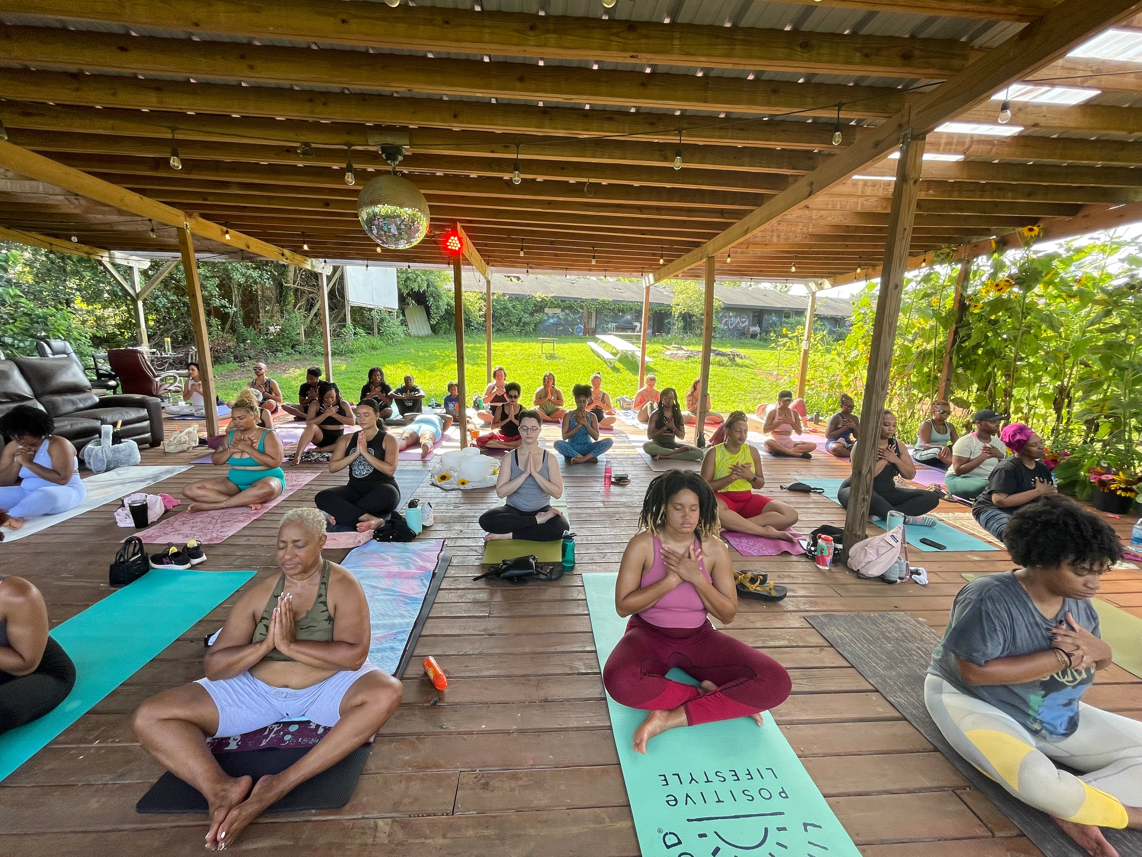 Petal and Poses held at Urban Sprout Farms is a therapeutic yoga and movement session led by Safia, founder of Yoga by Safia. (Courtesy of Petal and Poses)