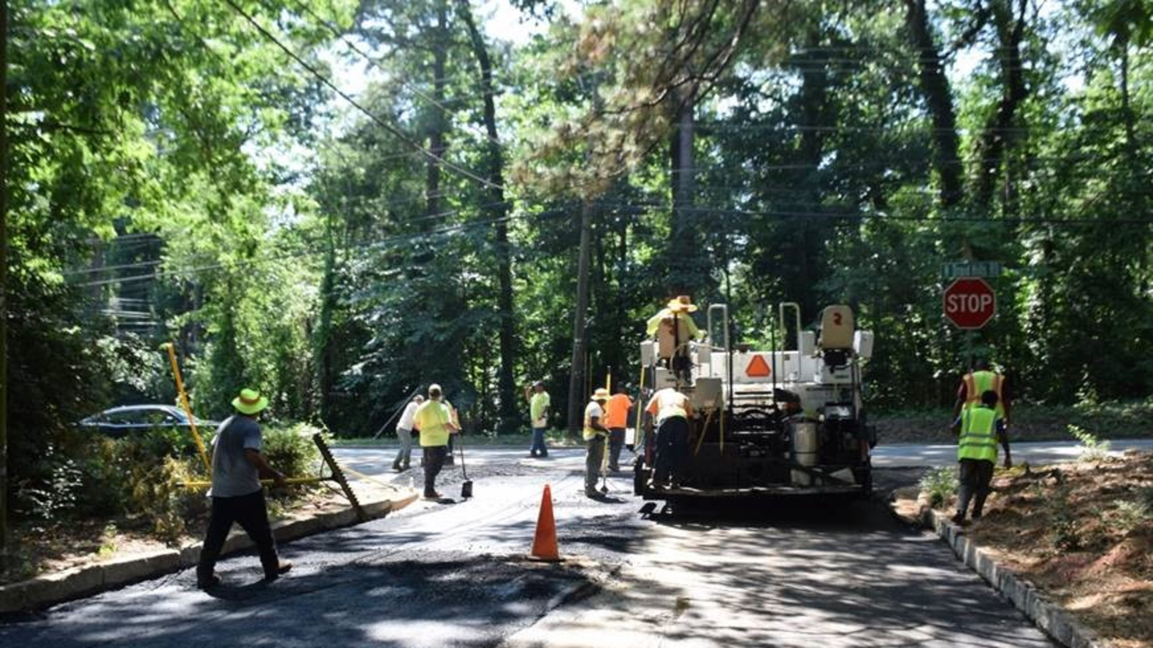 Crews pave Clearview Drive at North Druid Hills Road, one of the last streets to be paved this year.