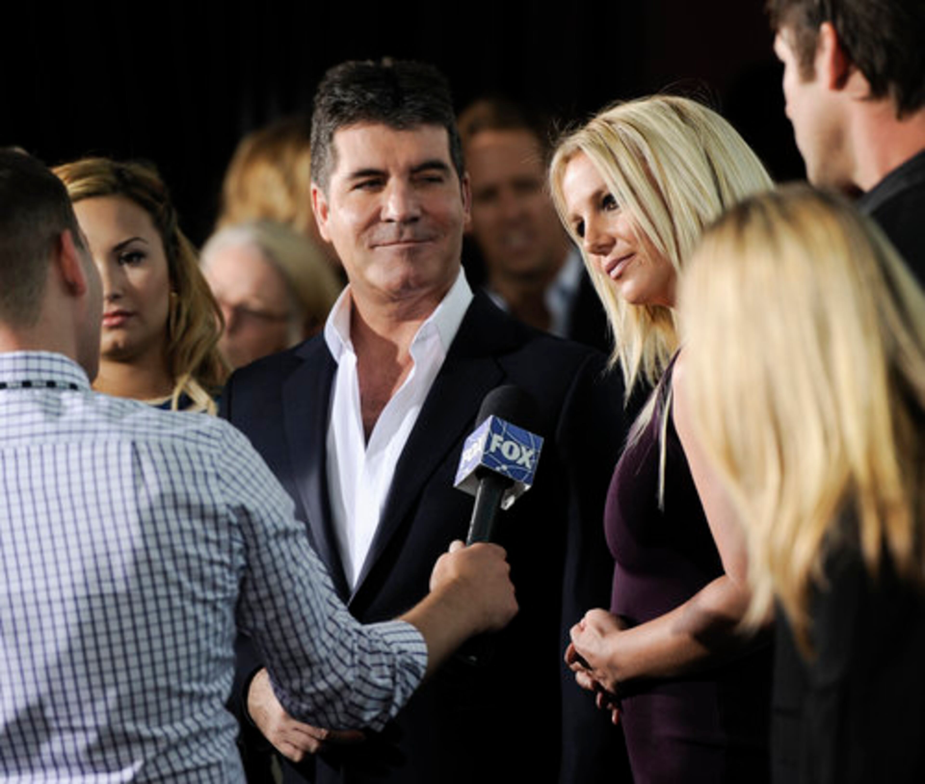 "The X Factor" judges Simon Cowell and Britney Spears attend the FOX network upfront presentation party at Wollman Rink, Monday, May 14, 2012 in New York.