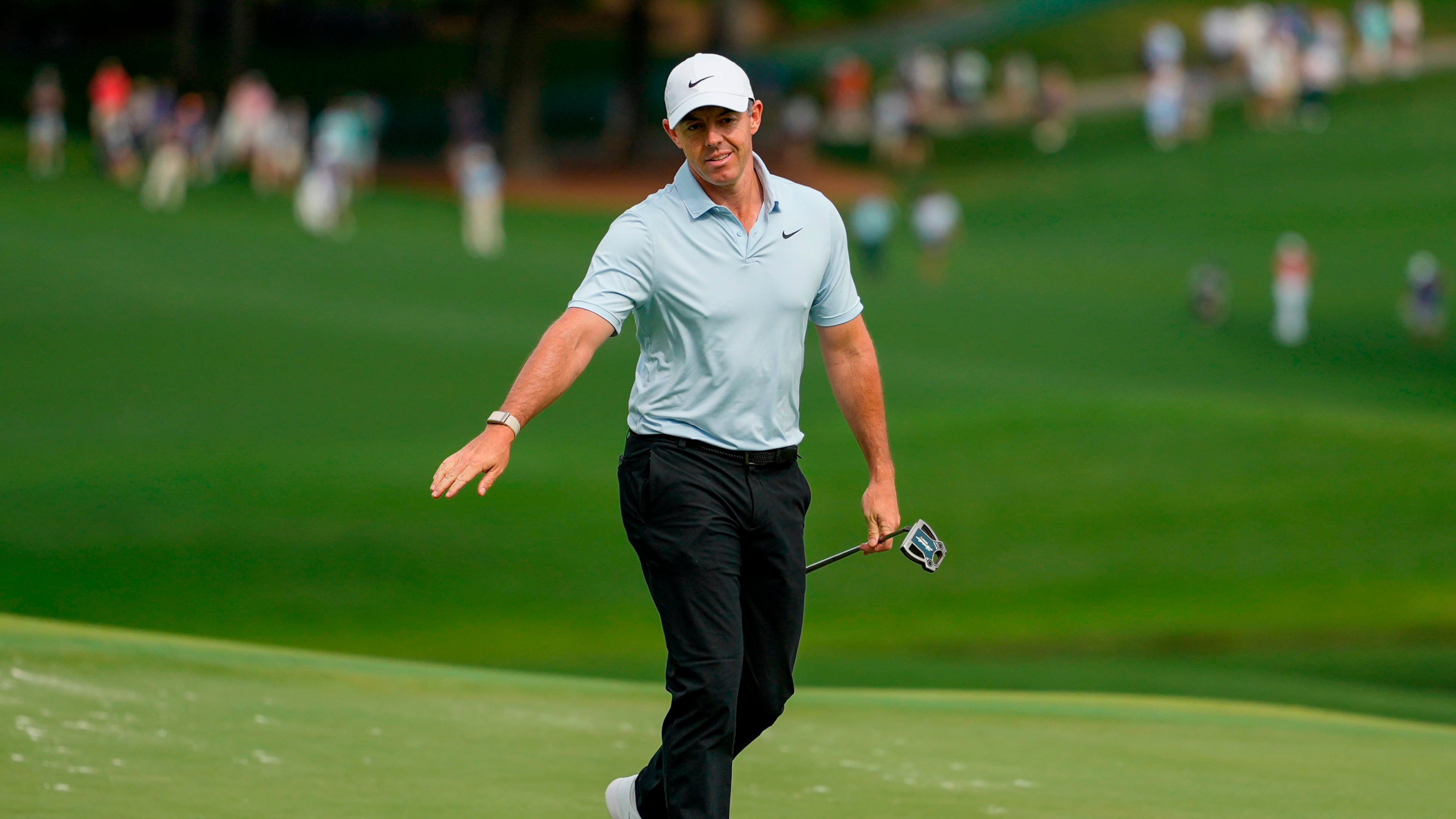 Rory McIlroy, of Northern Ireland, follows his shot on the 15th green during second round of the Truist Championship golf tournament at the Quail Hollow Club, Friday, May 8, 2026, in Charlotte, N.C. (AP Photo/Chris Carlson)