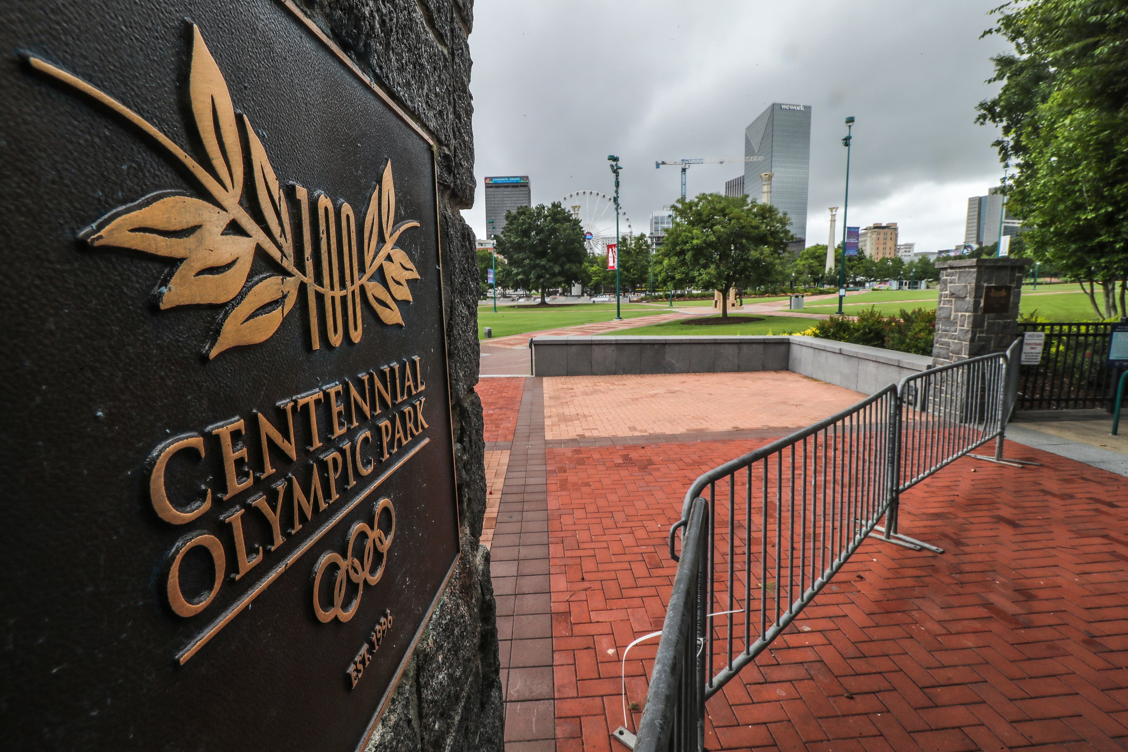 Gates were in place across entry ways in July 2020 at Atlanta’s Centennial Olympic Park. The annual July Fourth fireworks celebration at Centennial Olympic Park was canceled that year due to the pandemic. This year, fireworks return. JOHN SPINK/JSPINK@AJC.COM