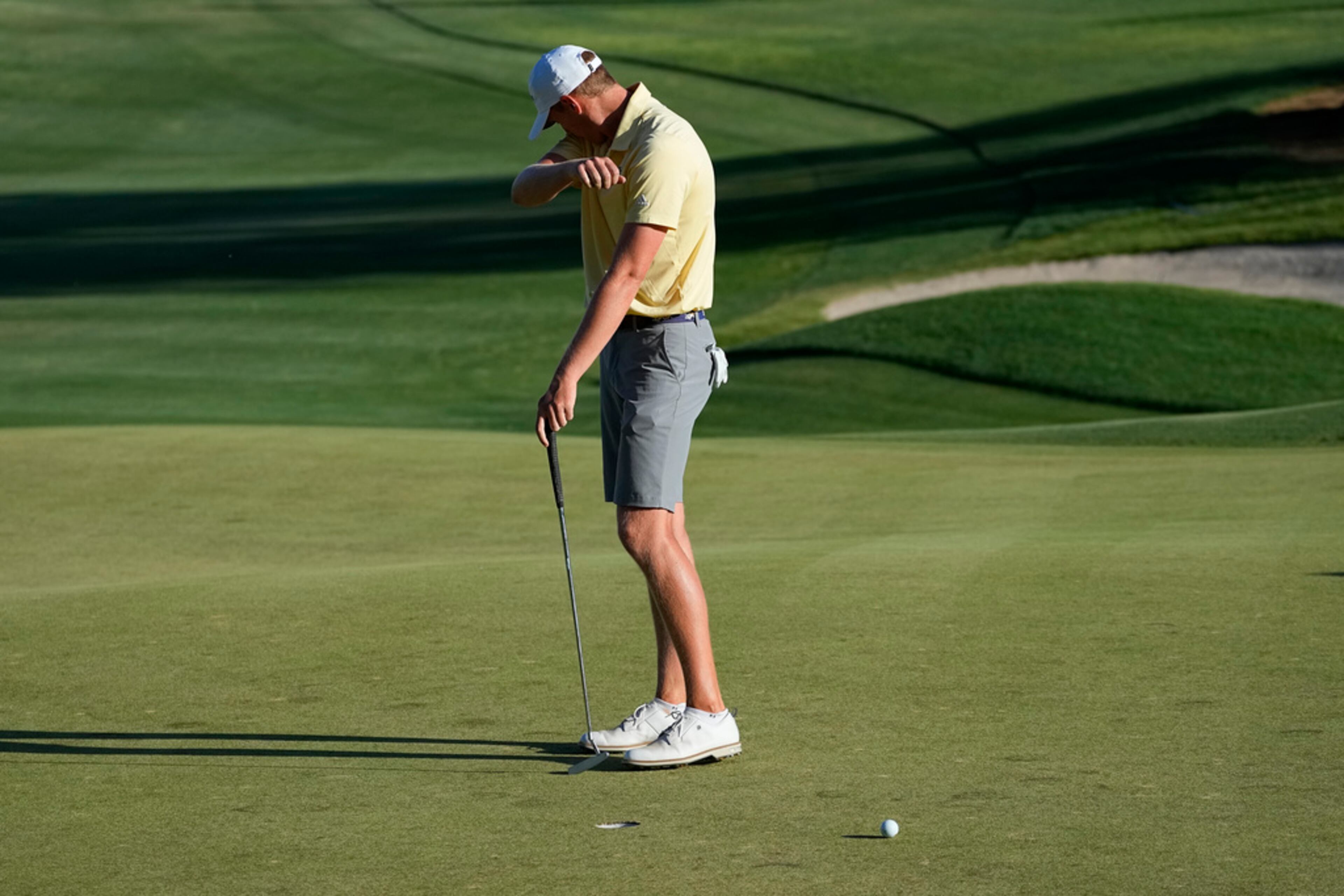 Georgia Tech golfer Bartley Forrester reacts after missing his putt on the 17th green during the final round of the NCAA college men's match play golf championship against Florida golfer Matthew Kress, Wednesday, May 31, 2023, in Scottsdale, Ariz. (AP Photo/Matt York)