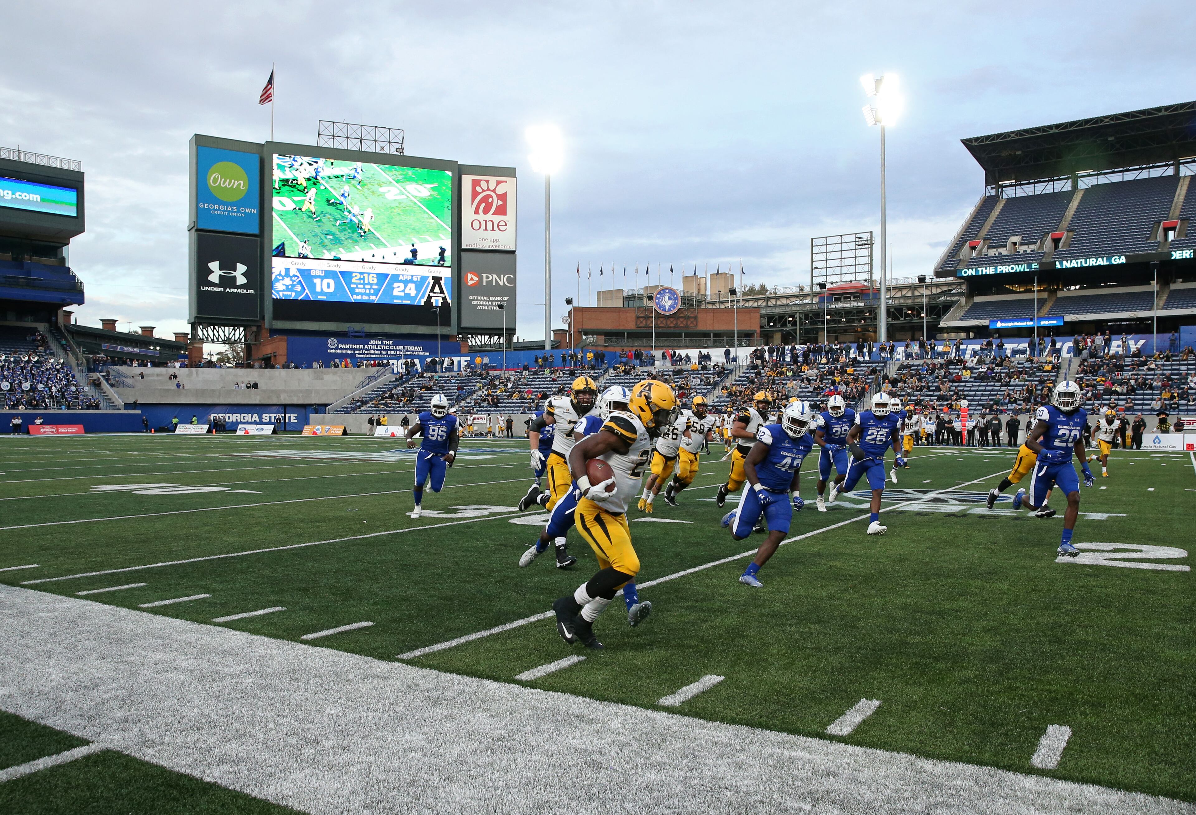 November 25, 2017 - Atlanta, Ga: Appalachian State Mountaineers running back Jalin Moore (25) runs for a first down in the second half of their game against the Georgia State Panthers at GSU Stadium Saturday, November 25, 2017, in Atlanta. Appalachian State Mountaineers won 31-10. PHOTO / JASON GETZ