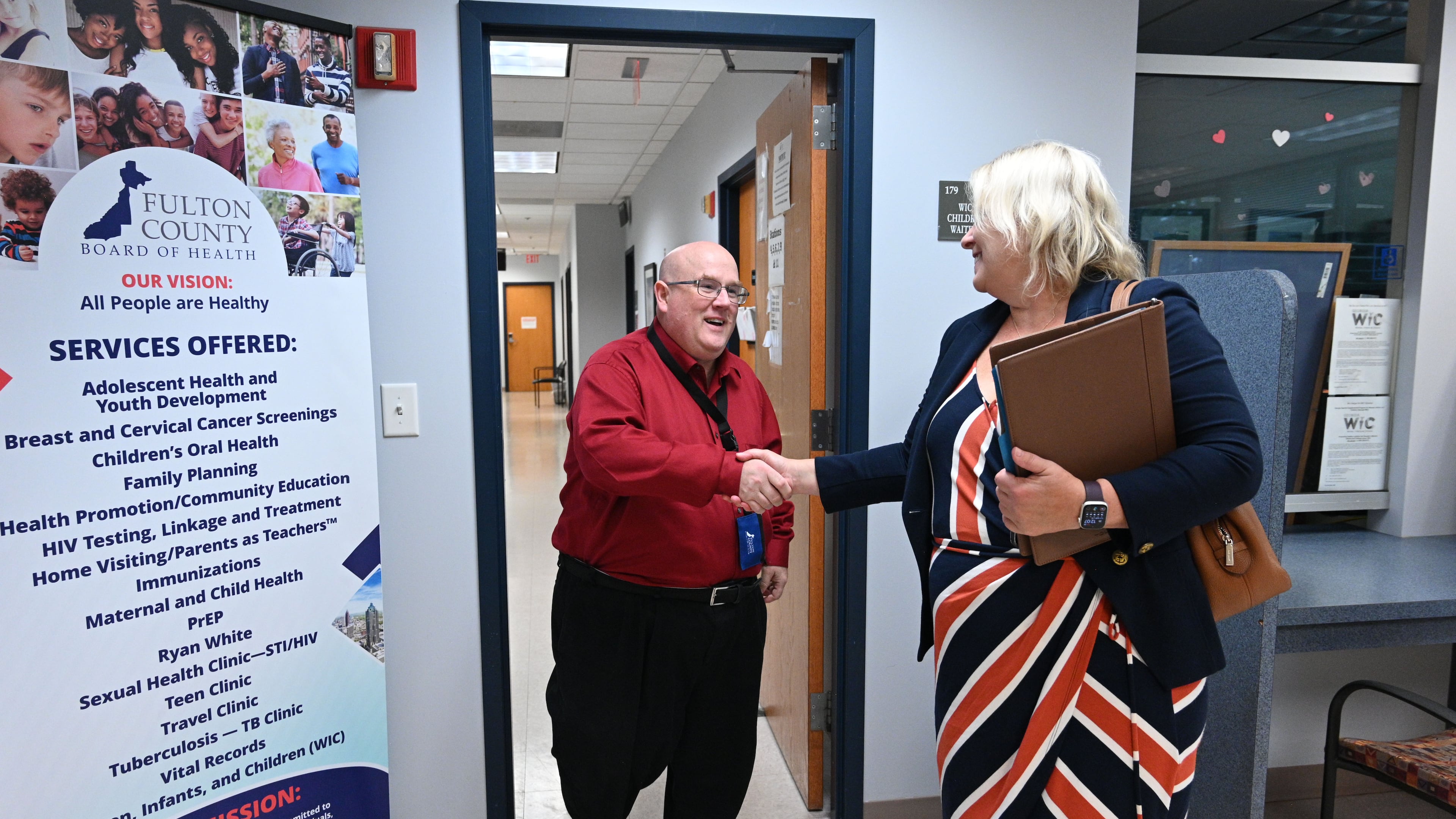 Dwayne Givens, Workforce Development Director, shakes hands with candidate Amy McEver after interviewing her during Fulton County Board of Health Career Fair at North Fulton Regional Health Center on Tuesday in Alpharetta. (Hyosub Shin / Hyosub.Shin@ajc.com)