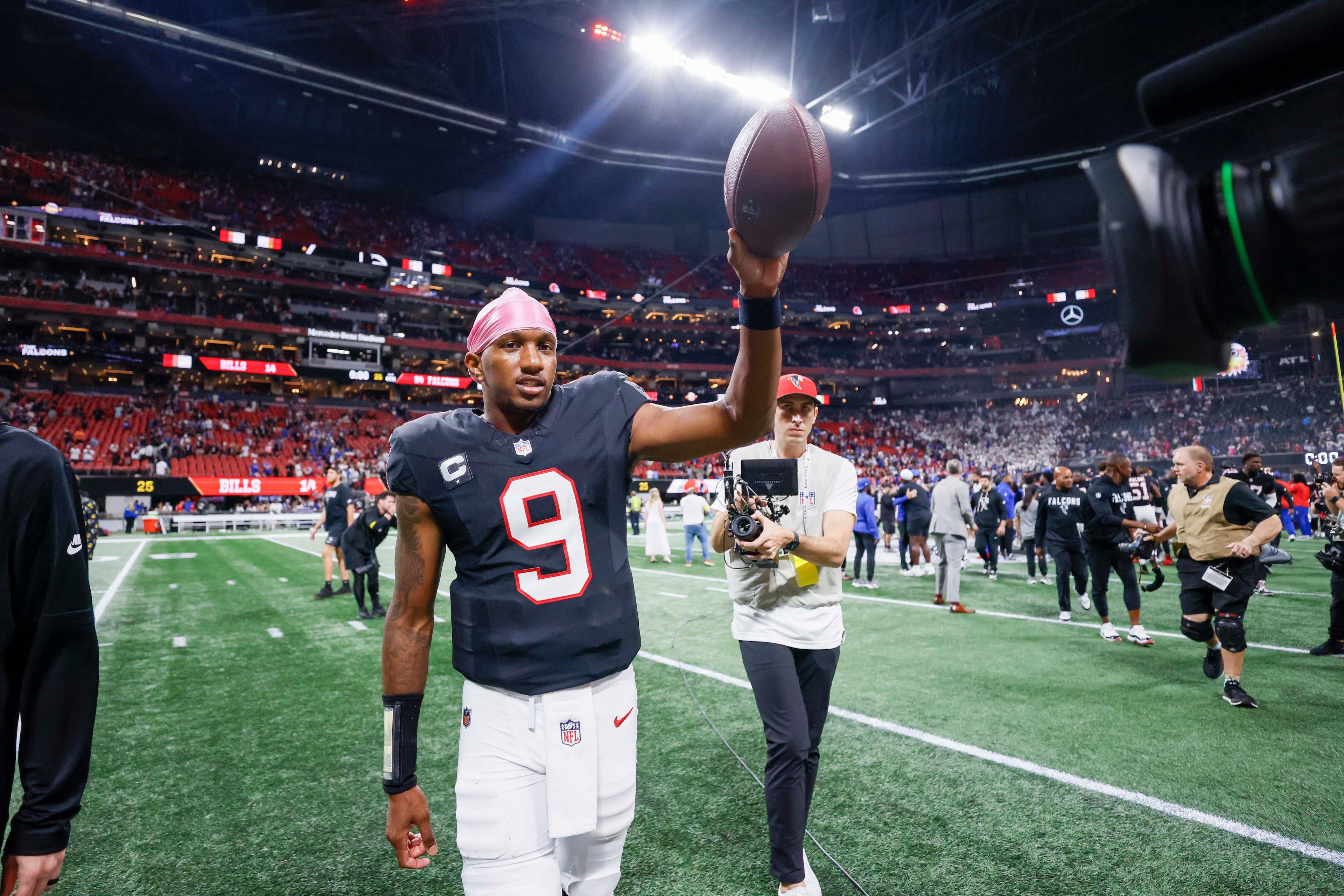 Atlanta Falcons quarterback Michael Penix Jr. (9) signals to the crowd after his team defeated the Buffalo Bills 24-14 at Mercedes-Benz Stadium in Atlanta on Monday, October 13, 2025. (Miguel Martinez/ AJC)