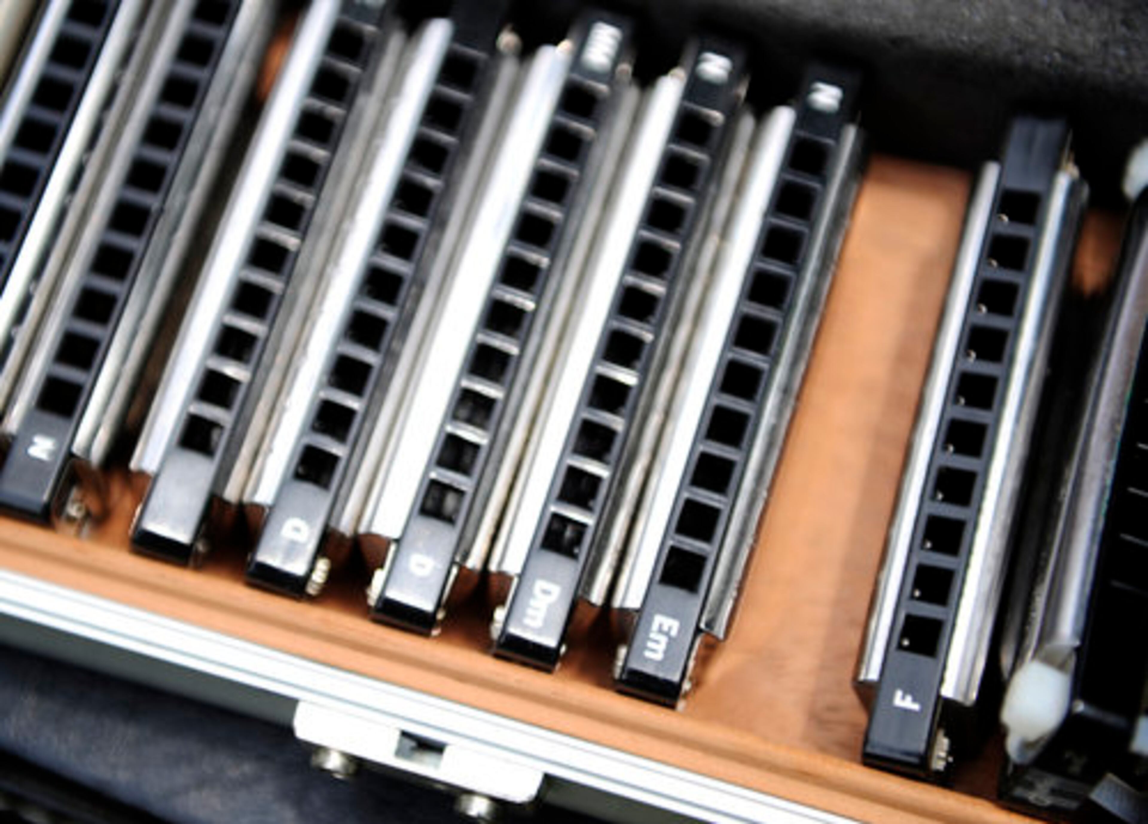 Adams keeps a box of different harmonica mouthpieces to accompany different keys noted on the piece.