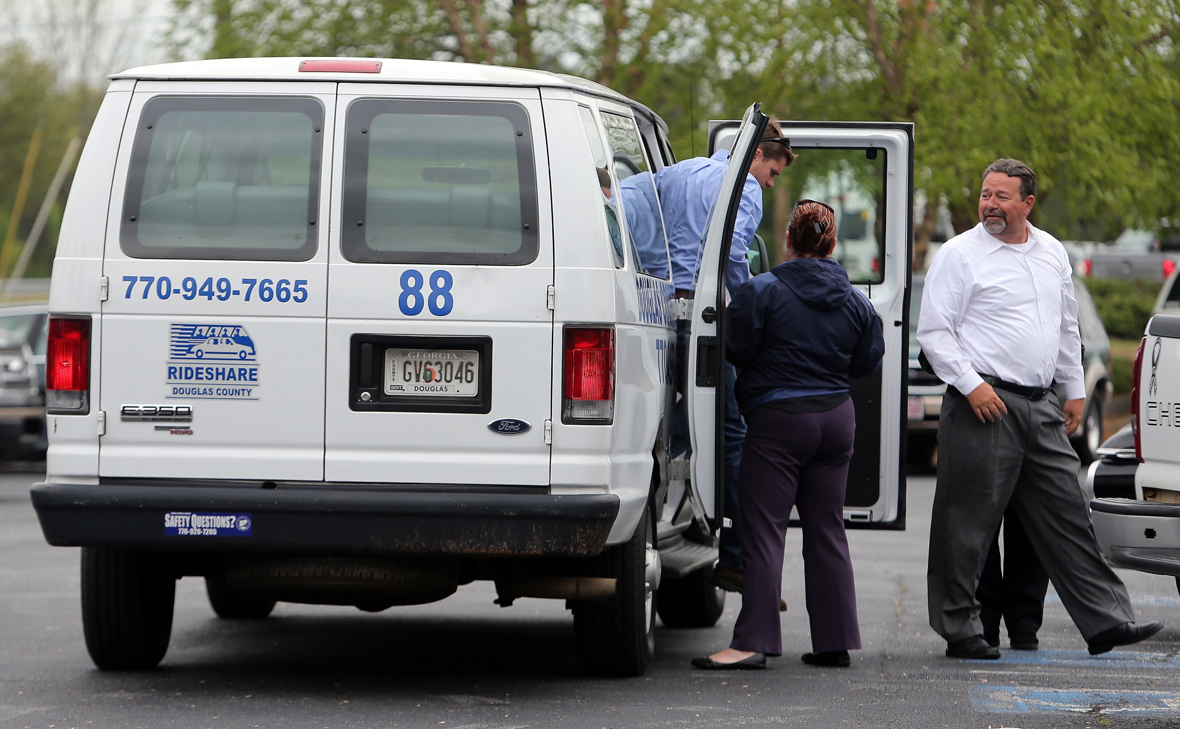 After the funeral home parking lot filled to capacity, rideshare vans were used to shuttle mourners to the visitation for Cpt. Herb Emory Tuesday afternoon April 15, 2014 in Douglasville. The public is invited to attend a celebration of Capt. Herb's life on Saturday morning from 10 a.m. to noon at the Johnson Ferry Baptist Church in east Cobb. Emory died on April 12 of a heart attack he suffered while assisting at a wreck site near his Douglas County home. BEN GRAY/bgray@ajc.com