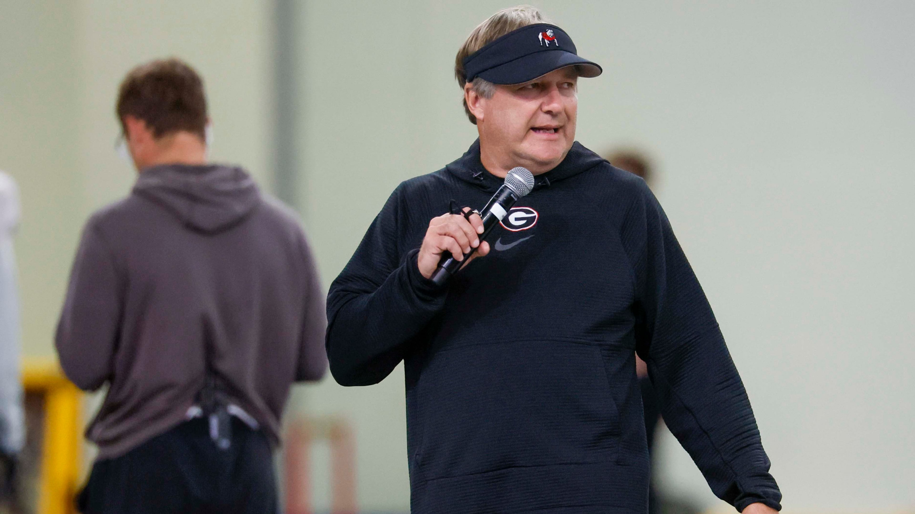 Georgia coach Kirby Smart — pictured giving instructions during practice Wednesday, Aug. 5, 2026 — said of the recent ruling allowing players from the 2022 signing class who have completed four years of eligibility to return for a fifth season: “So, if somebody knew what was coming, kind of like a crystal ball, and they said, ‘We’re gonna sit at 100 so we can bring five guys in,’ they were a lot smarter than me." (Miguel Martinez/AJC)