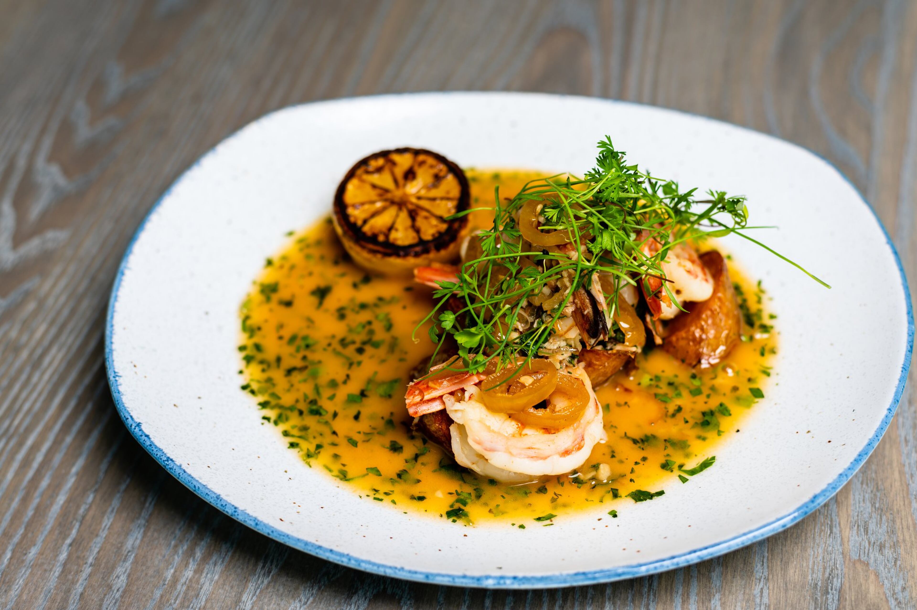 You’ll want some bread handy to sop up the sauce that comes with the Georgia White Shrimp Provencal at Aix. CONTRIBUTED BY HENRI HOLLIS