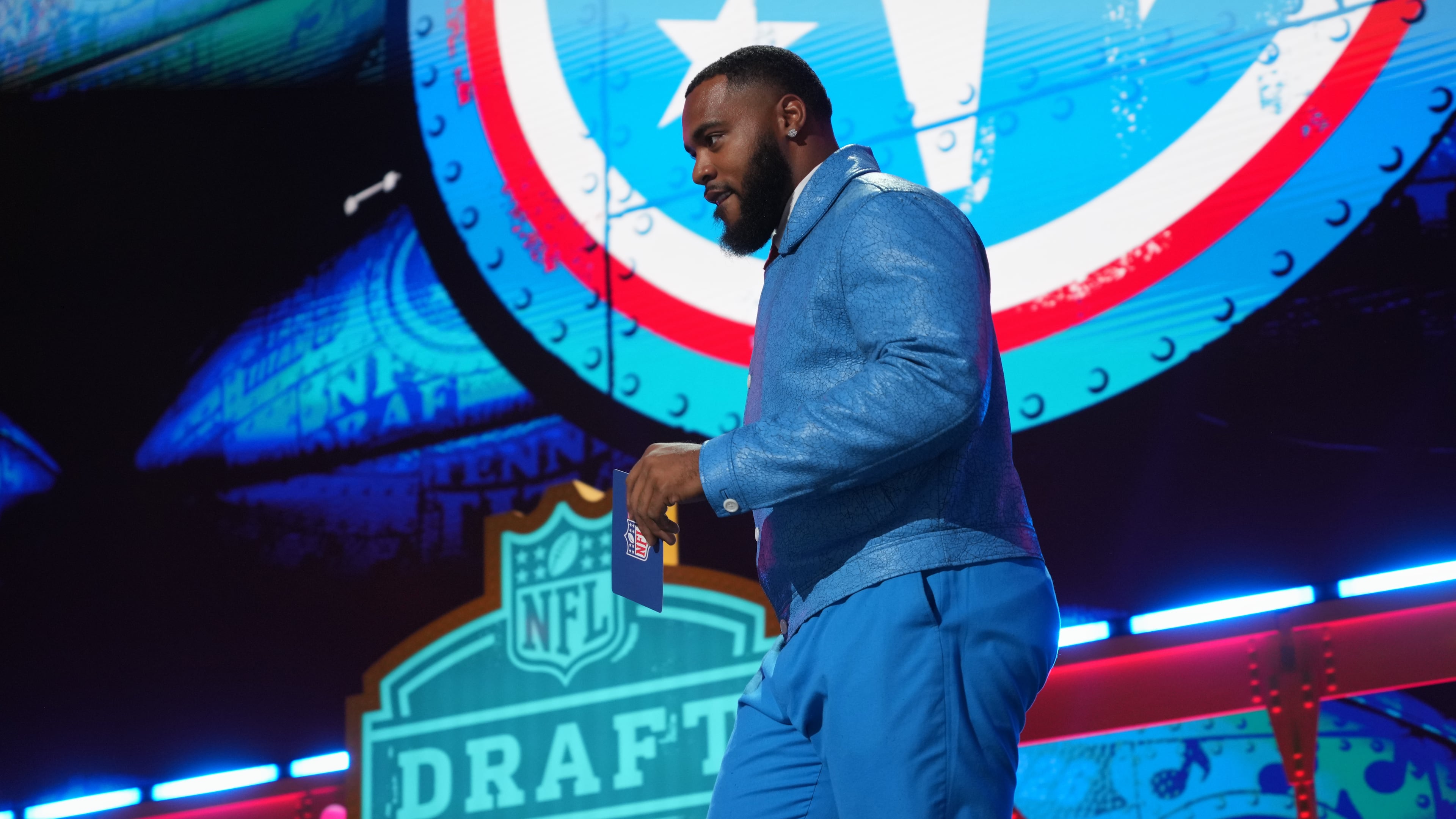 Tennessee Titans' Jeffery Simmons walks across the stage before announcing a pick by the Tennessee Titans during the second round of the NFL football draft, Friday, April 24, 2026, in Pittsburgh. (AP Photo/Gene J. Puskar)