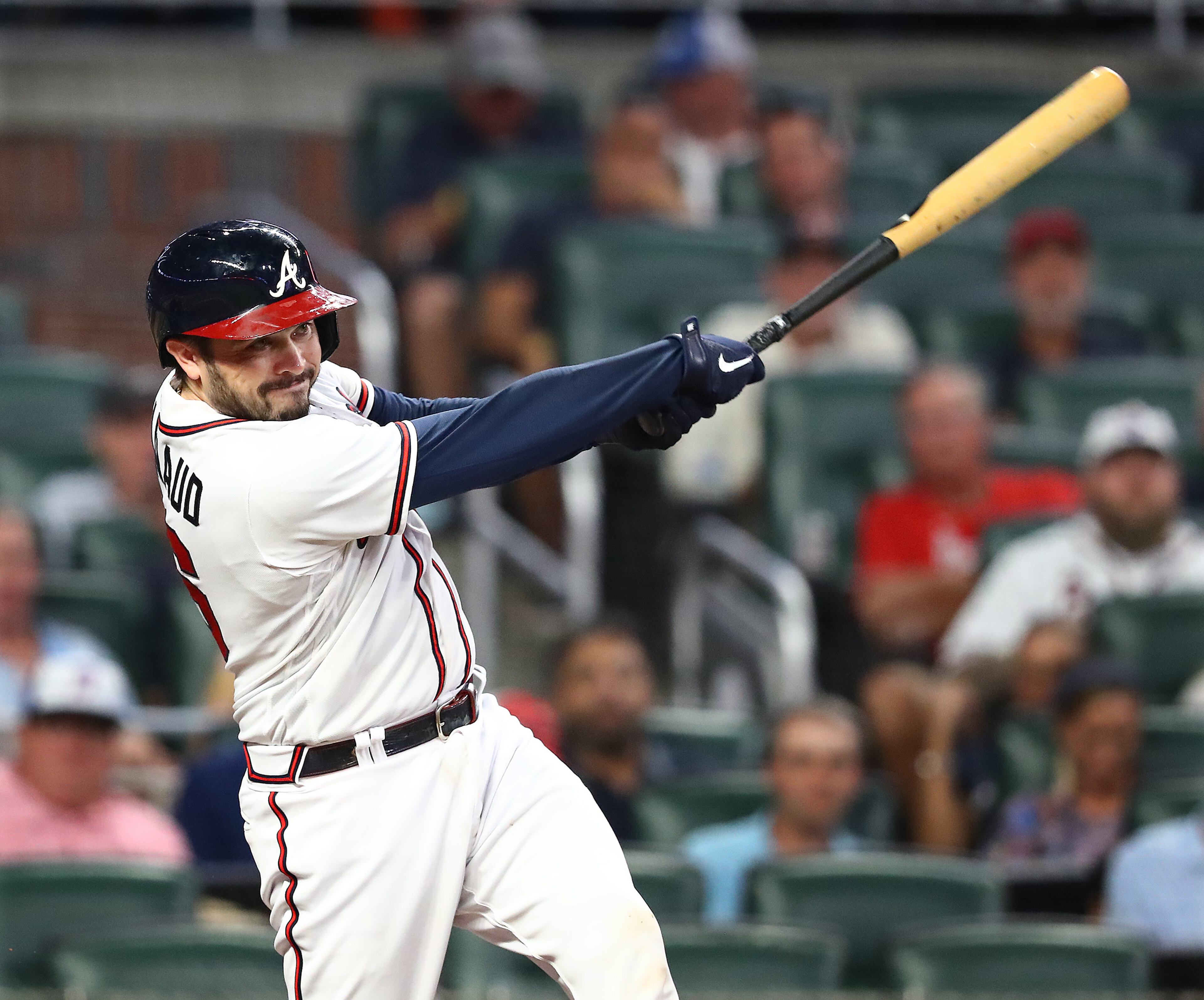 Braves catcher Travis d'Arnaud hits an RBI single against the Nationals during the fourth inning Monday night at Truist Park. (Curtis Compton / Curtis Compton@ajc.com)