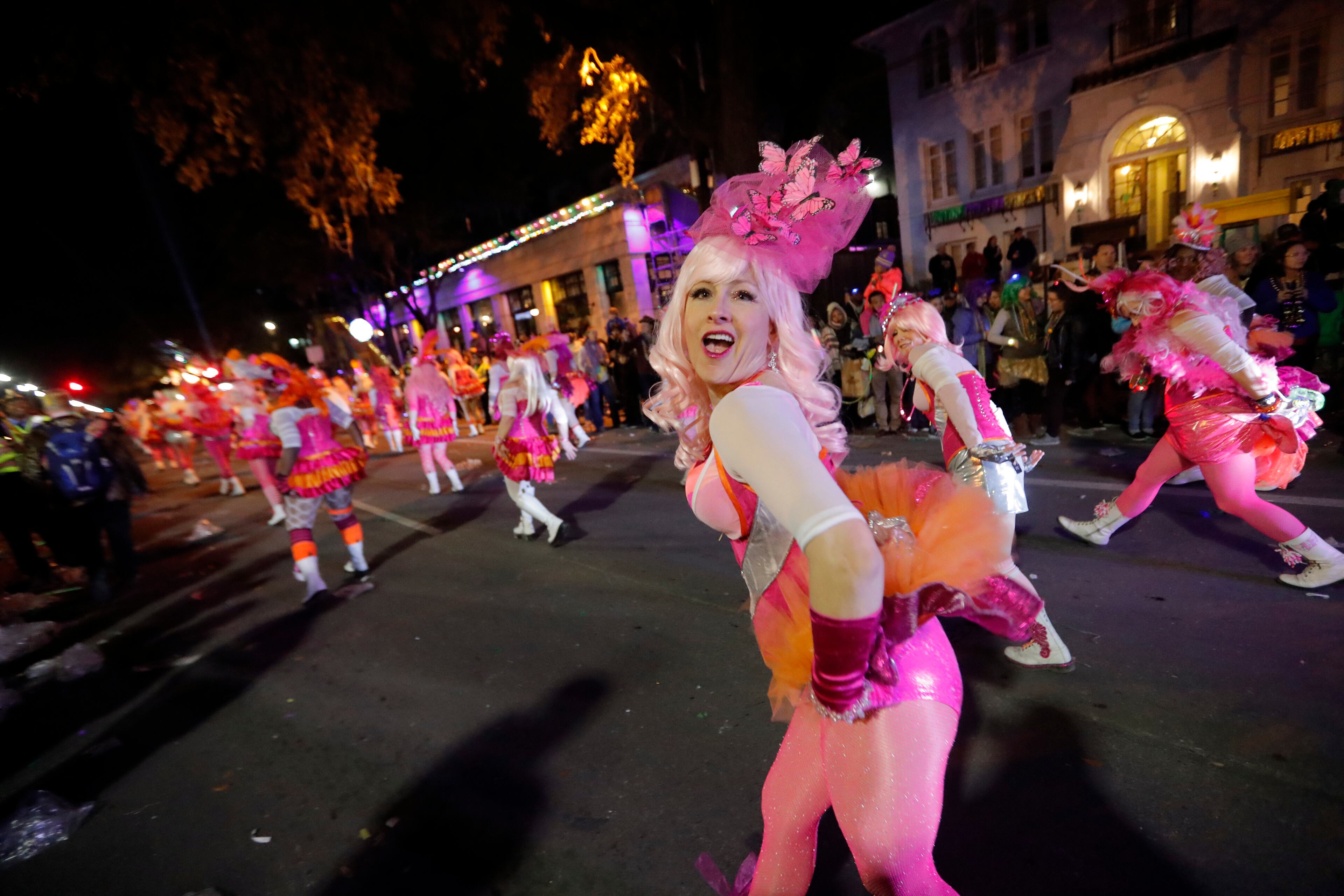 Members of the Pussyfooters dance at the Krewe of Cleopatra Mardi Gras parade in New Orleans, Friday, Feb. 2, 2018. Mardi Gras season is kicking into high gear with a slew of major parades throughout New Orleans. Although Carnival season officially began Jan. 6, the festivities really kick into high gear the two weekends ahead of Fat Tuesday. This year Fat Tuesday is Feb. 13. (AP Photo/Gerald Herbert)