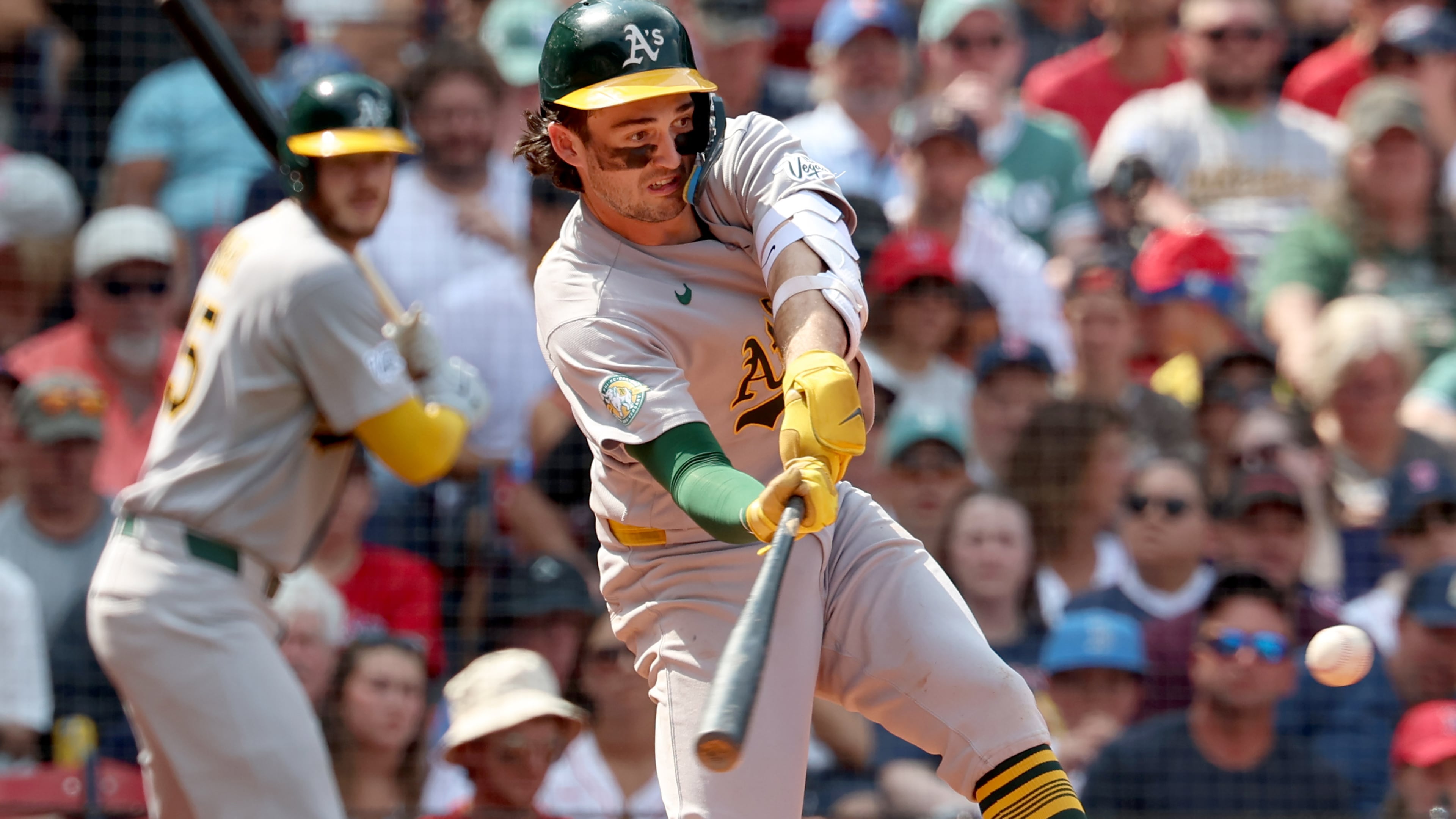 Athletics' Jacob Wilson takes a strike swinging during the fifth inning of a baseball game against the Boston Red Sox, Sunday, Aug. 9, 2026, in Boston. (AP Photo/Mark Stockwell)