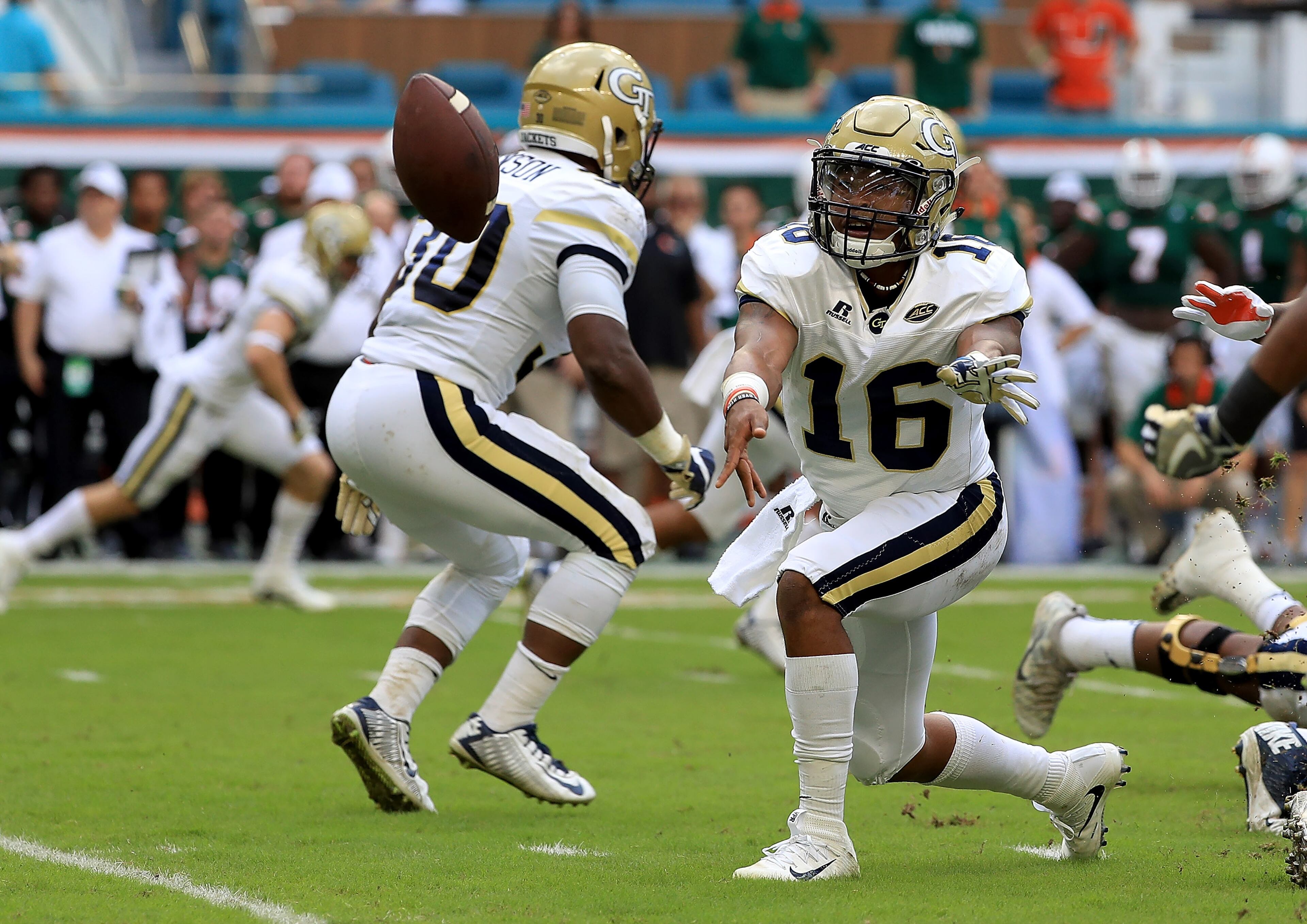 Jackets QB TaQuon Marshall pitches the ball on a play during the first half of Saturday's game. (Photo by Mike Ehrmann/Getty Images)