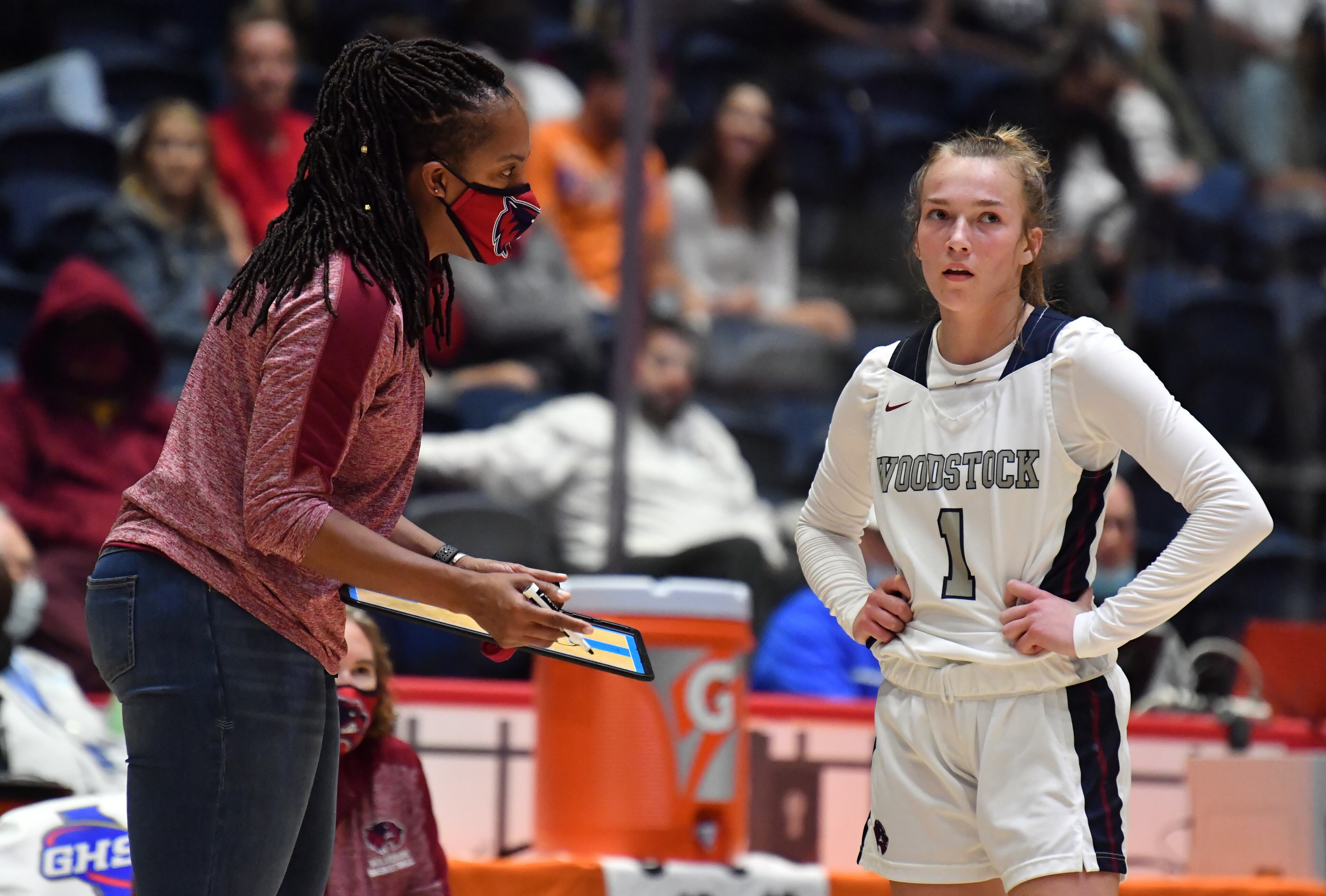 March 13, 2021 Macon - Woodstock's head coach Regina Tate-Leslie instructs Woodstock's Bridget Utberg (1) during the 2021 GHSA State Basketball Class AAAAAAA Girls Championship game at the Macon Centreplex in Macon on Saturday, March 13, 2021 Marietta won 52-47 over Woodstock. (Hyosub Shin / Hyosub.Shin@ajc.com)