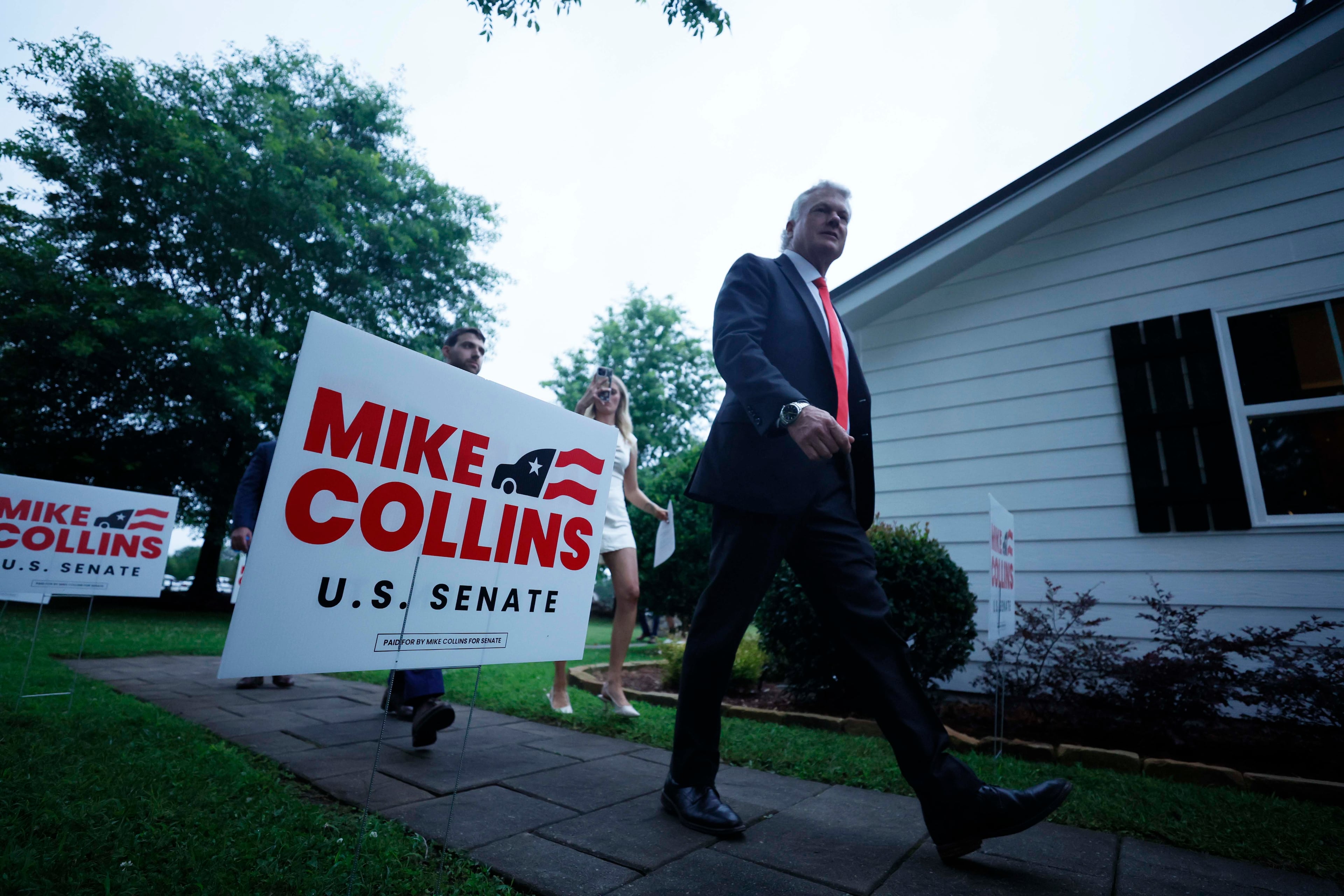 U.S. Rep. Mike Collins walks to the holding room after greeting supporters during the runoff election watch party at Seven Oaks Manor in Jackson, Georgia, on Tuesday, June 16, 2026. (Miguel Martinez/AJC)