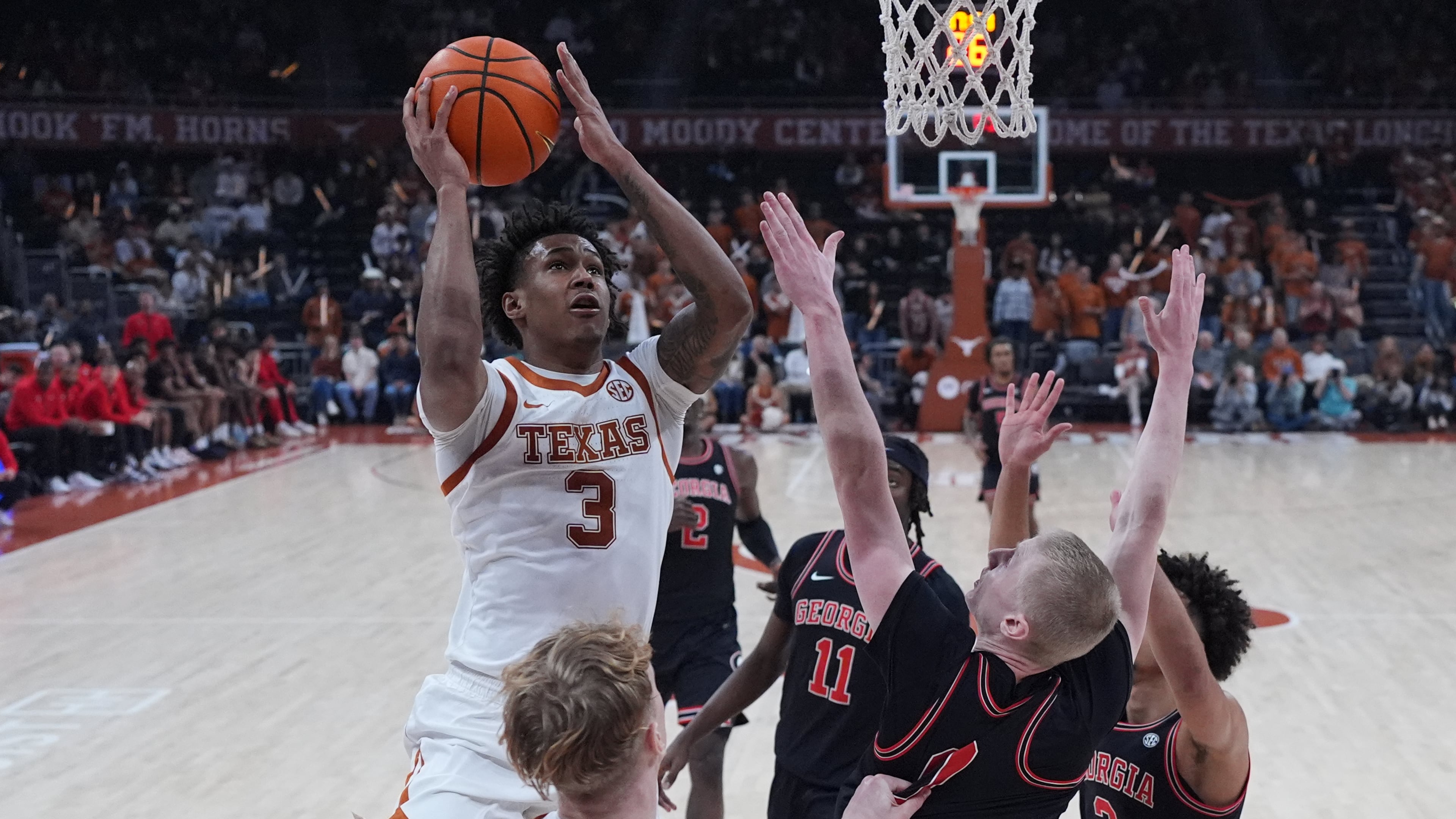 Texas guard Dailyn Swain (3) shoots the ball against Georgia during the second half of an NCAA college basketball game in Austin, Texas, Saturday, Jan. 24, 2026. (AP Photo/Eric Gay)
