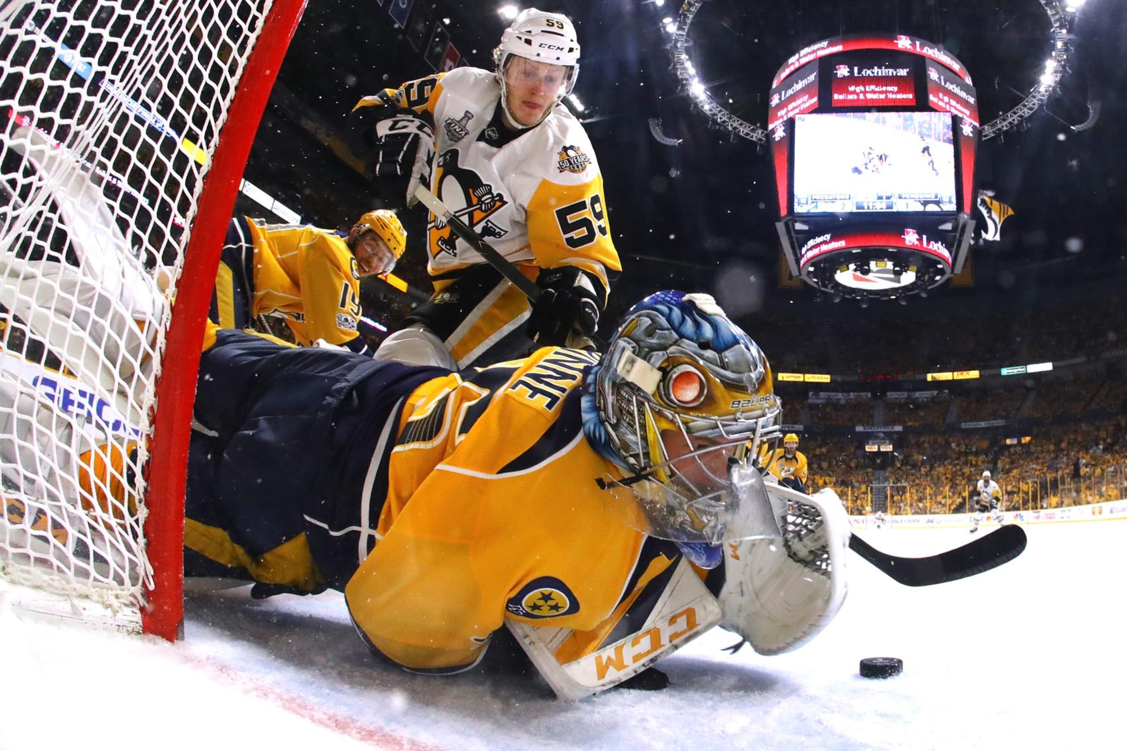NASHVILLE, TN - JUNE 05: Pekka Rinne #35 of the Nashville Predators makes a glove save against Jake Guentzel #59 of the Pittsburgh Penguins during the second period in Game Four of the 2017 NHL Stanley Cup Final at the Bridgestone Arena on June 5, 2017 in Nashville, Tennessee. (Photo by Bruce Bennett/Getty Images)