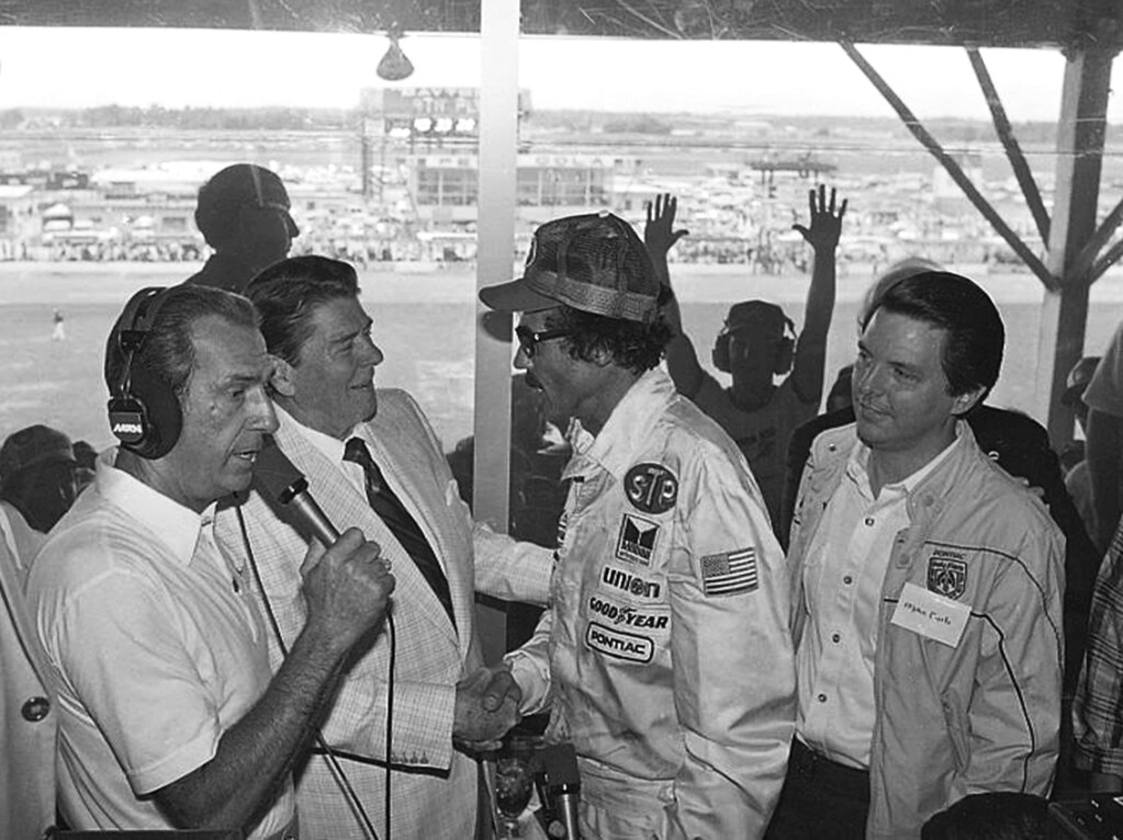 FILE - In this July 4, 1984, file photo, President Ronald Reagan congratulates stock car driver Richard Petty, who won the Firecracker 400 race at the Daytona International Speedway in Daytona Beach, Fla. (AP Photo/Ira Schwarz, File)