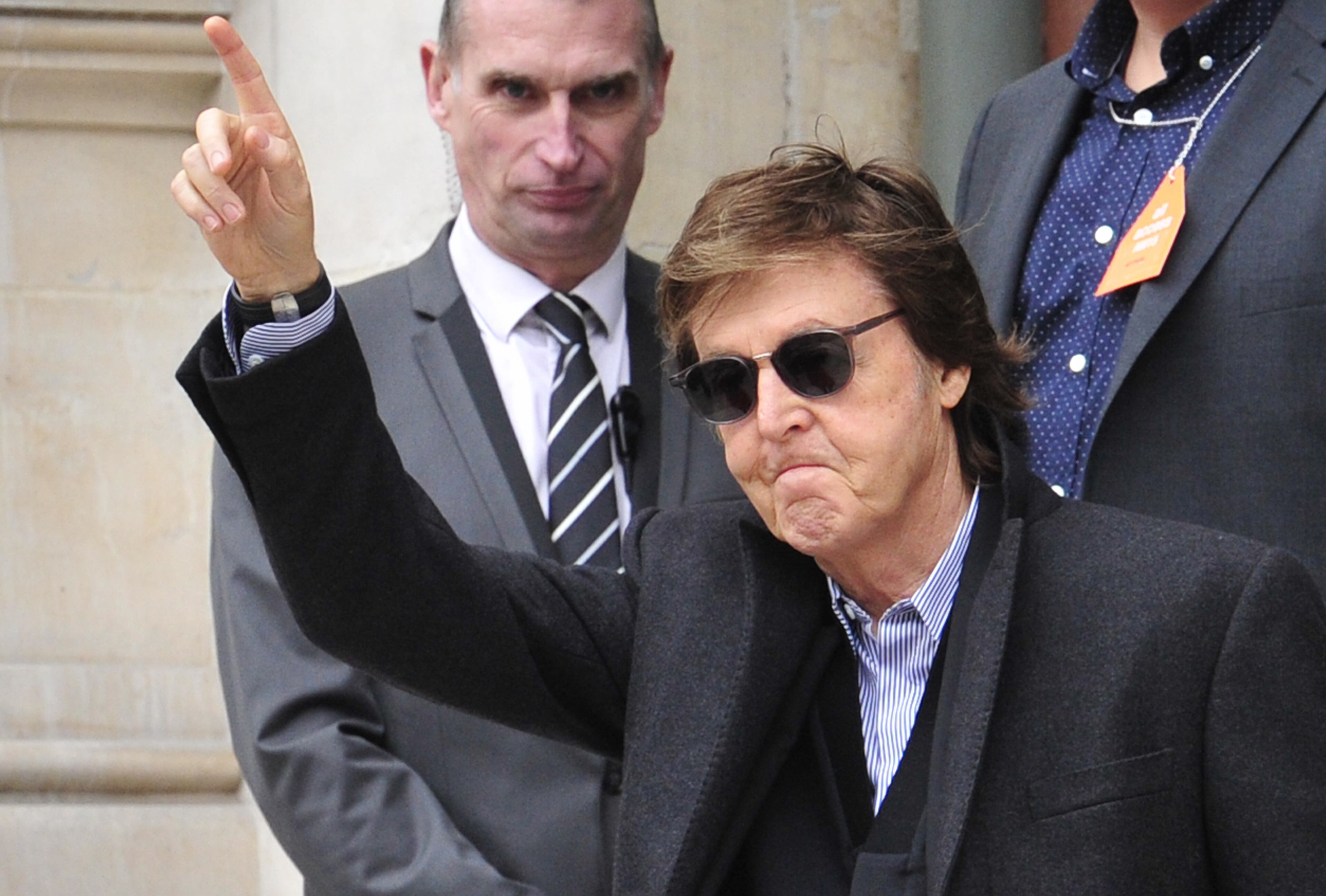 Sir Paul McCartney leaves Stella McCartney's ready to wear fall-winter 2015-2016 fashion collection presented during Paris fashion week, Paris, France, Monday, March 9, 2015. (AP Photo/Zacharie Scheurer)