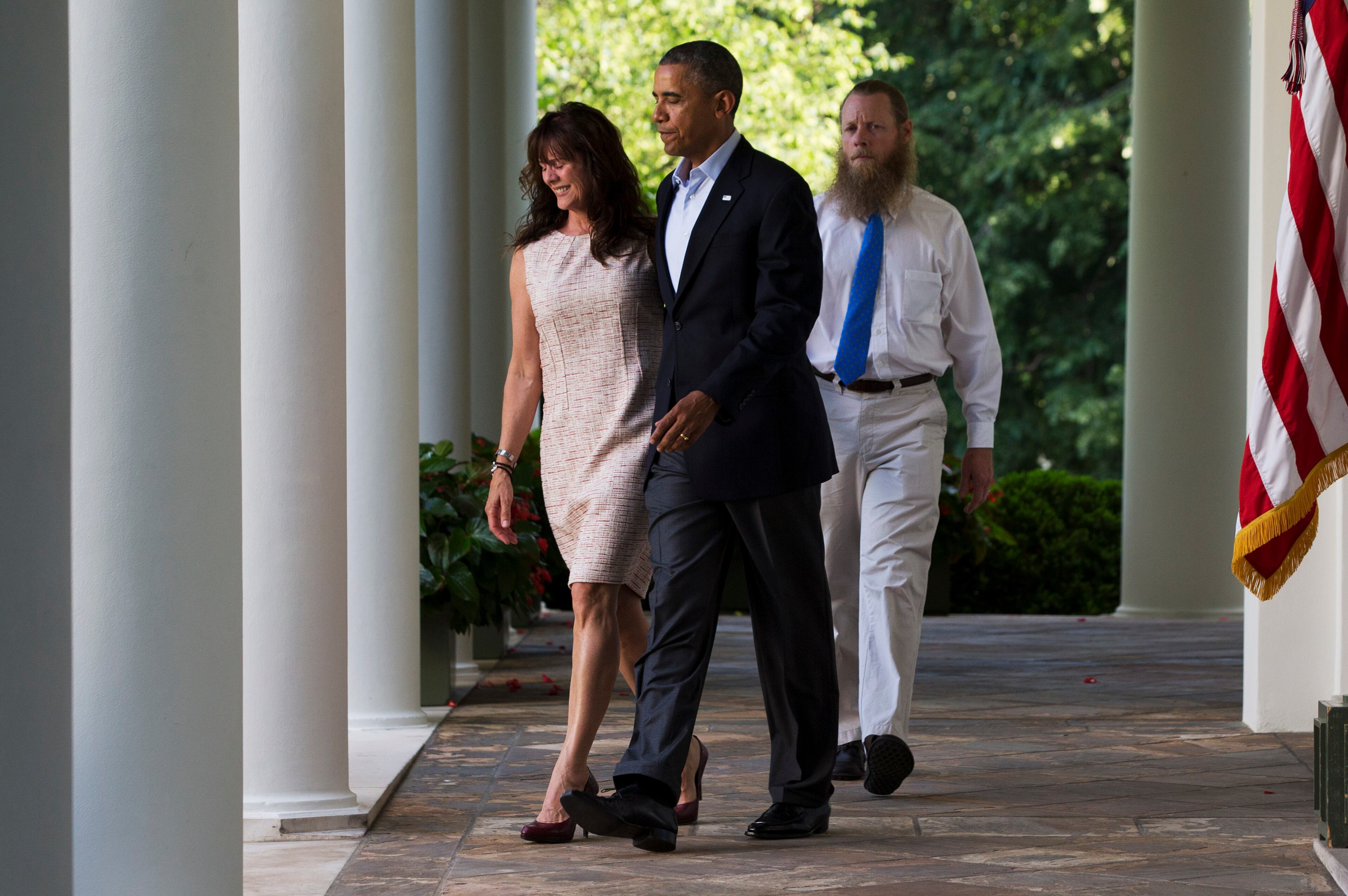 Jani Bergdahl, left, and Bob Bergdahl, walk with President Barack Obama for a news conference in the Rose Garden of the White House in Washington on Saturday, May 31, 2014 about the release of their son, U.S. Army Sgt. Bowe Bergdahl. Bergdahl, 28, had been held prisoner by the Taliban since June 30, 2009. He was handed over to U.S. special forces by the Taliban in exchange for the release of five Afghan detainees held by the United States. (AP Photo/Jacquelyn Martin)