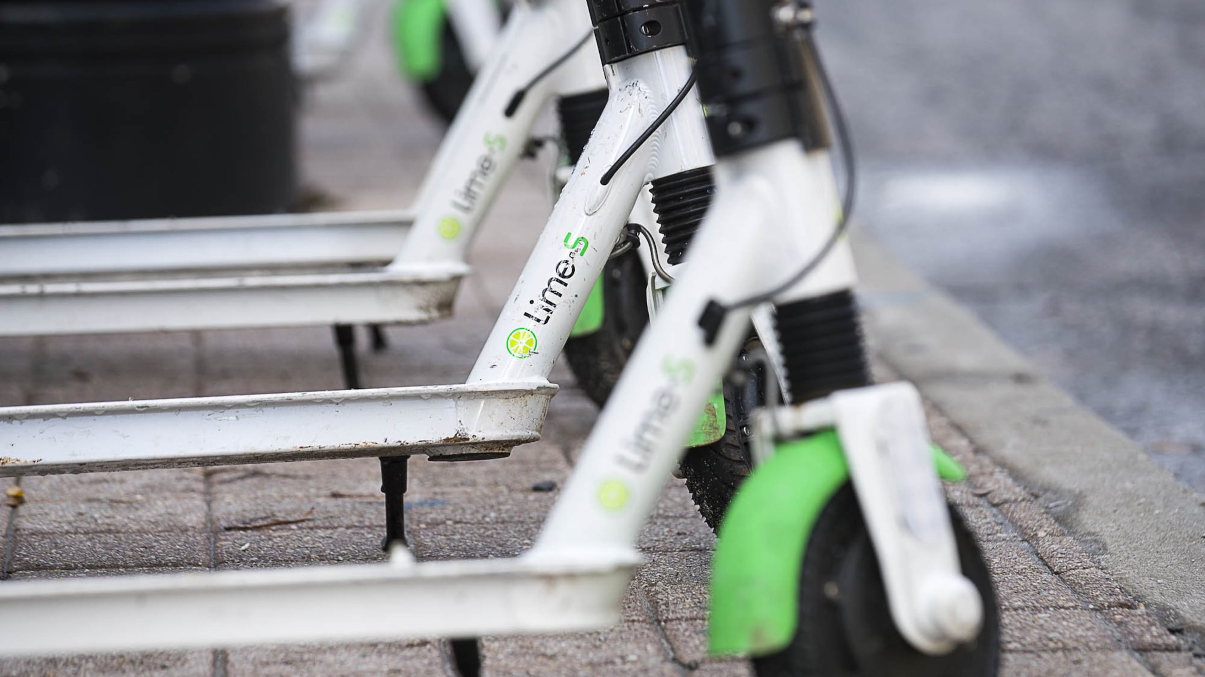 01/04/2019 — Atlanta, Georgia — Lime Scooters sit parked on Peachtree Street in Atlanta’s Midtown community, Friday, January 4, 2019. (ALYSSA POINTER/ALYSSA.POINTER@AJC.COM)
