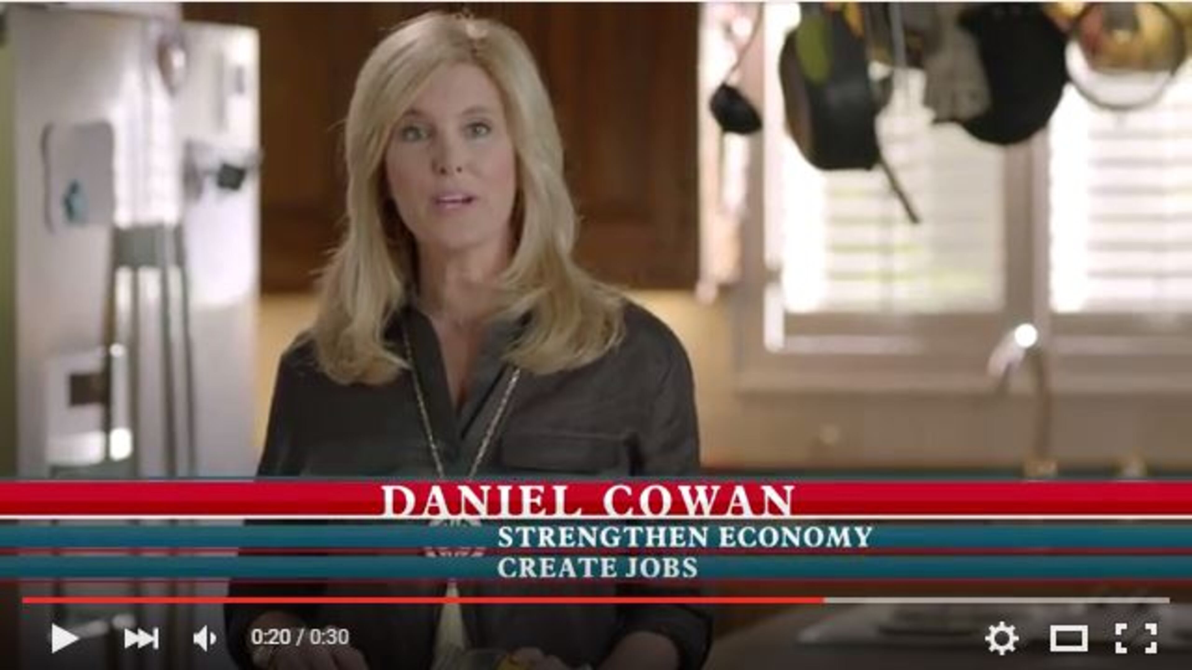 A screen grab shows a scene from Daniel Cowan's new ad in the GOP's 11th District congressional race.