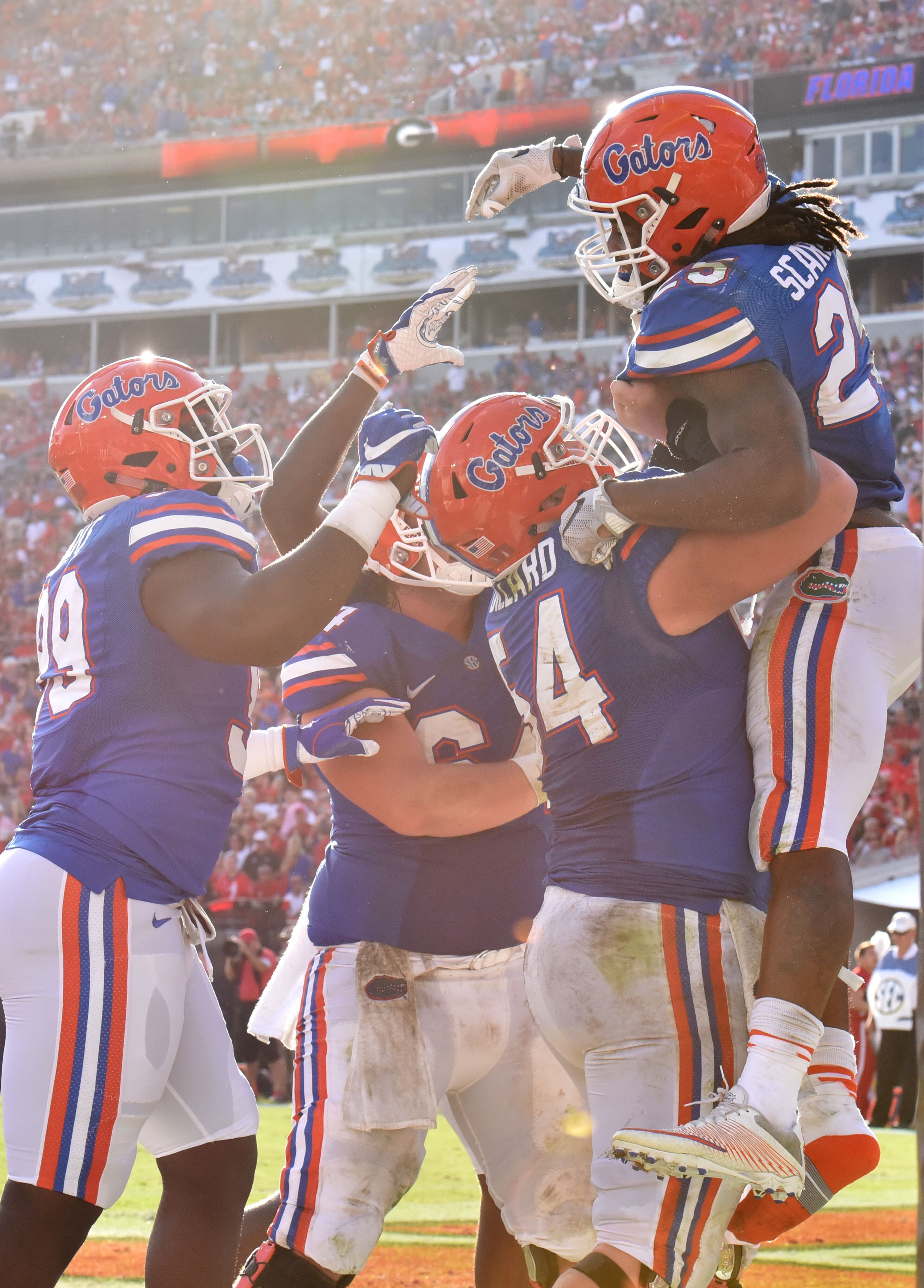 October 29, 2016 Jacksonville, Fla. - Florida running back Jordan Scarlett (25) celebrates with teammates after he scored a touchdown in the first half at EverBank Field in Jacksonville, Florida on Saturday, October 29, 2016. HYOSUB SHIN / HSHIN@AJC.COM