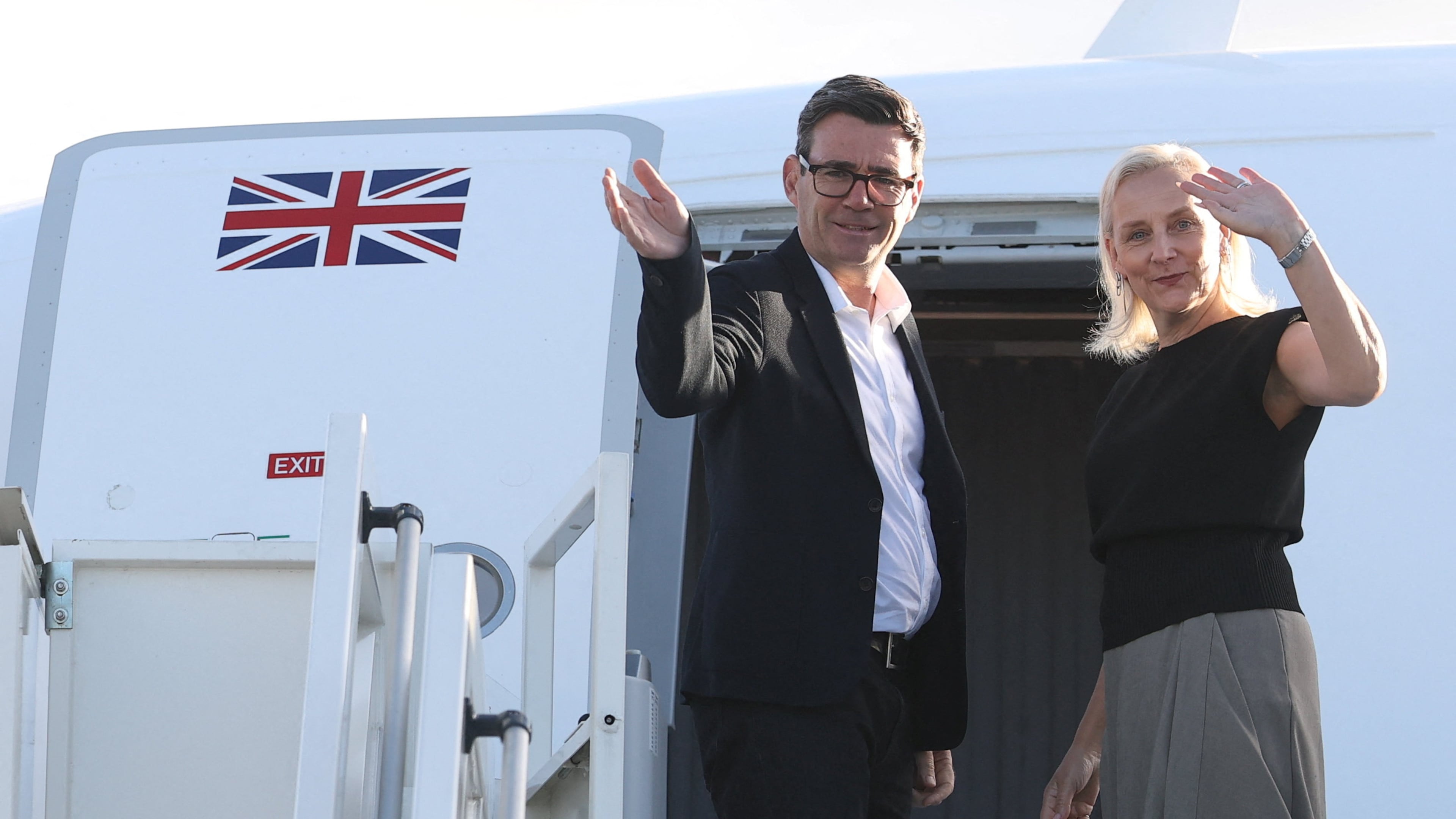 Britain's Prime Minister Andy Burnham and his wife Marie-France van Heel board a plane for the United States, at Stansted Airport, Stansted, England, Monday Sept. 21, 2026, to attend the UN General Assembly in New York. (Toby Melville/Pool Photo via AP)