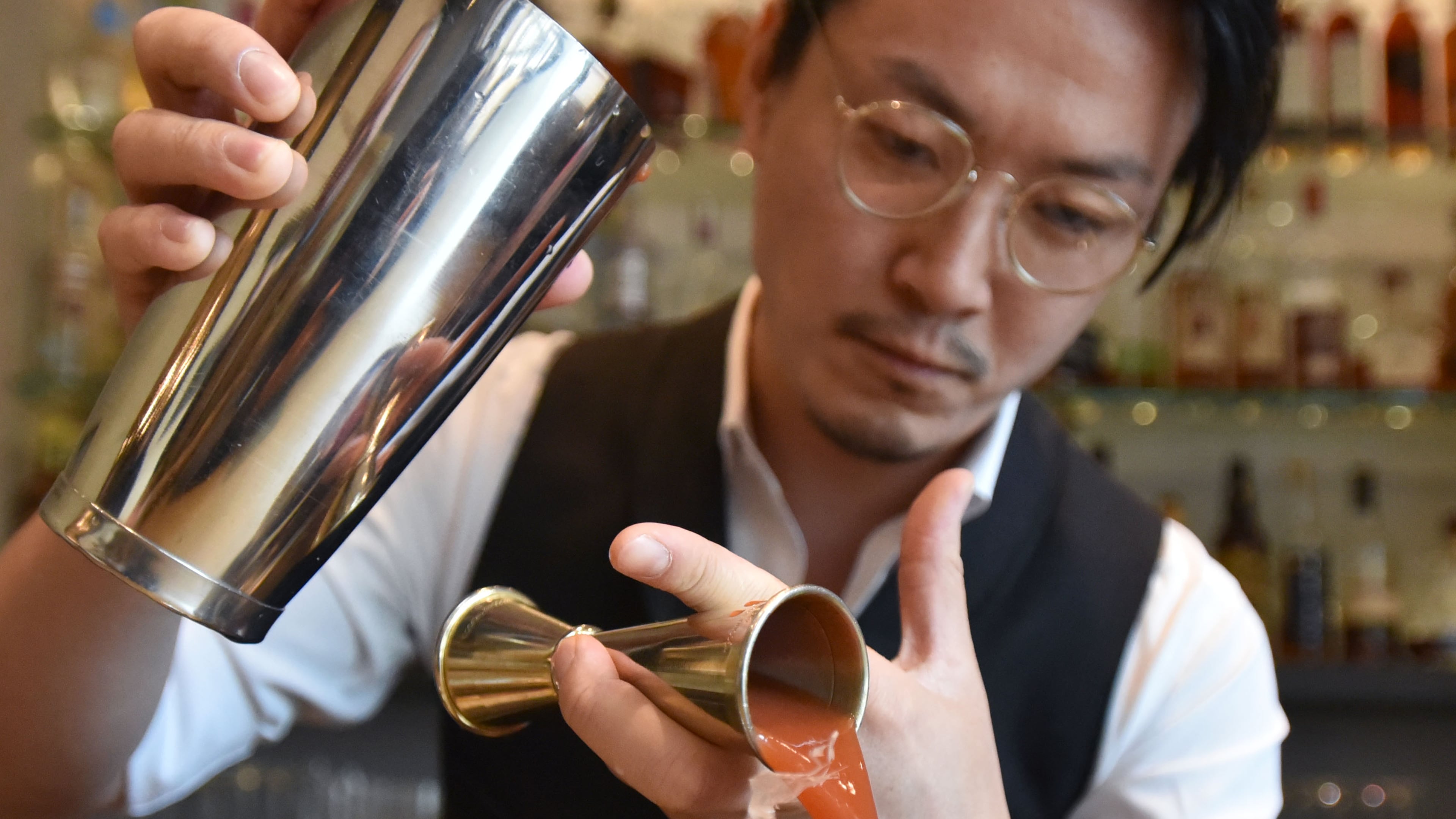 Shingo Gokan makes a Japanese-style Bloody Mary at Umi in April, preparing for Himitsu's opening. HYOSUB SHIN / HSHIN@AJC.COM