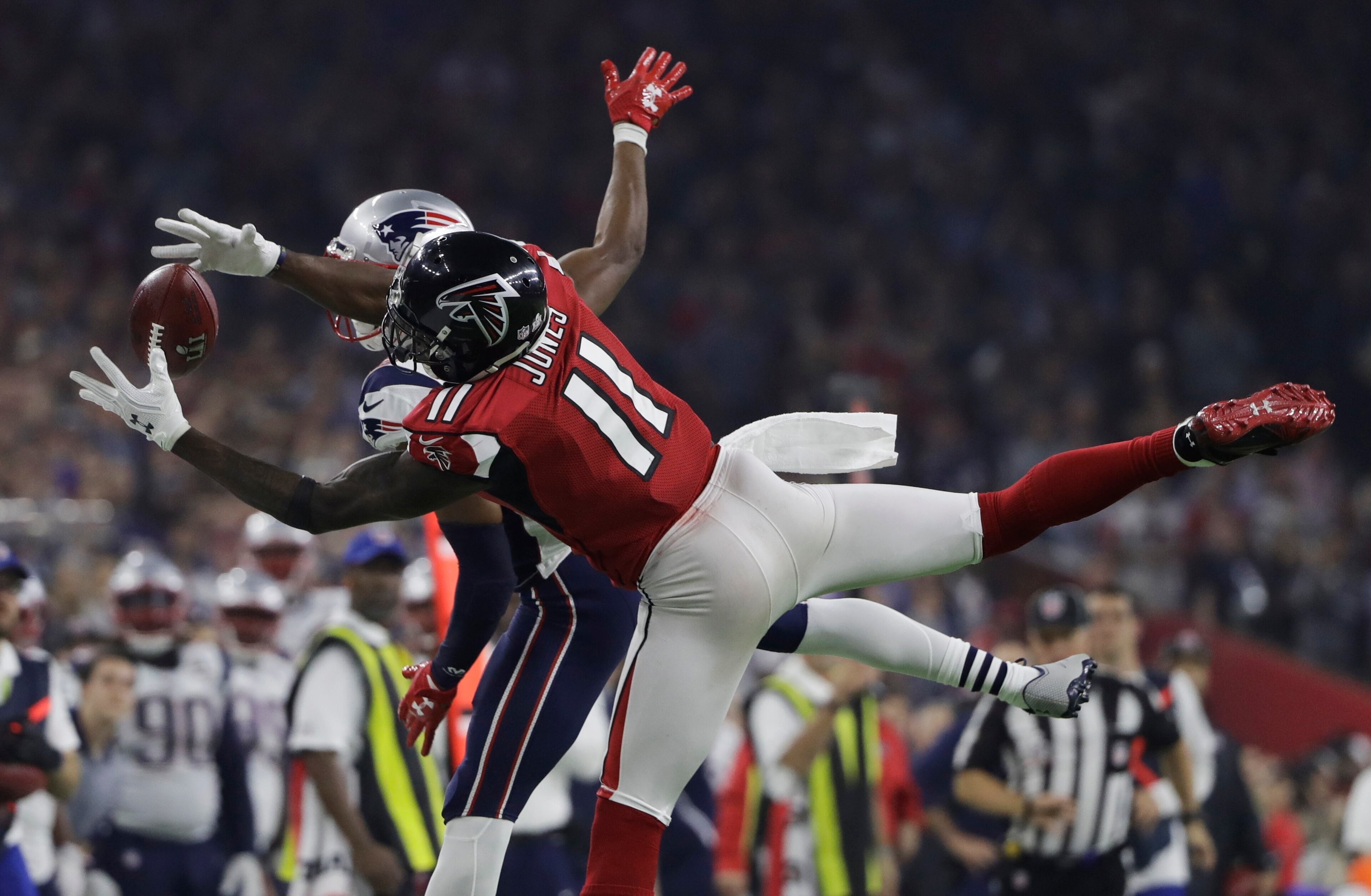 Atlanta Falcons' Julio Jones catches a pass ahead of New England Patriots' Eric Rowe during the second half of the NFL Super Bowl 51 football game Sunday, Feb. 5, 2017, in Houston. (AP Photo/Elise Amendola)