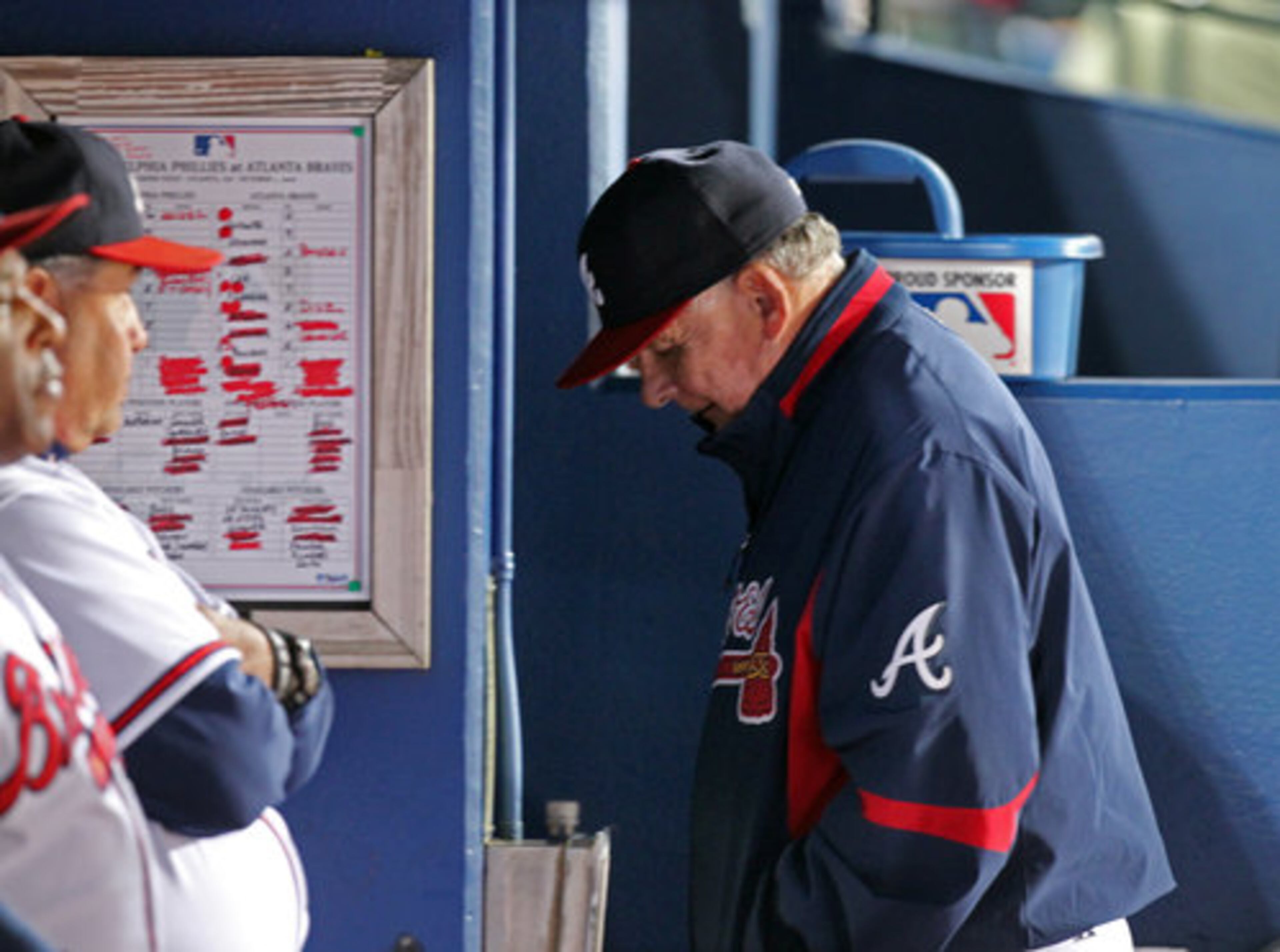 Bobby Cox hangs his head after the Braves lost the first game of the series 11-5.