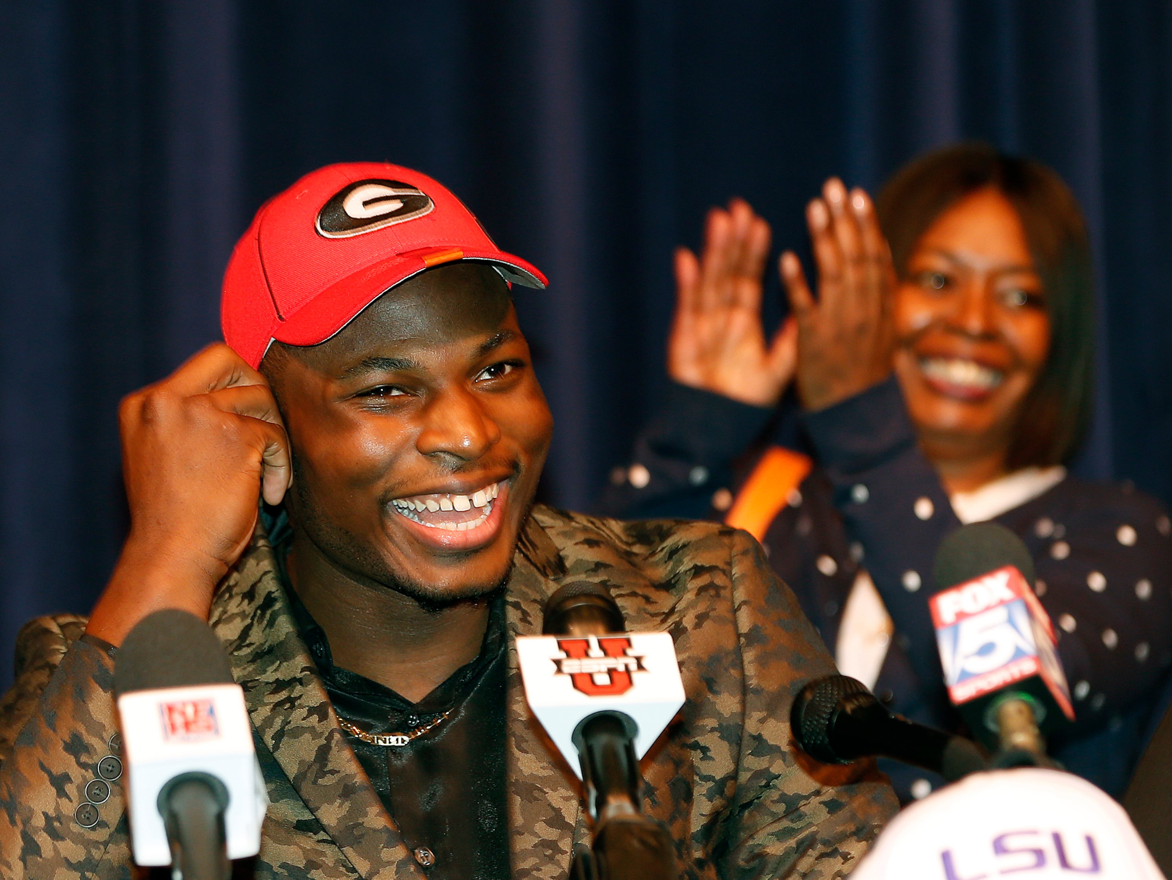 Norcross High School defensive end Lorenzo Carter announces that he plans to play NCAA college football at Georgia during a news conference Wednesday, Feb. 5, 2014, in Atlanta. Carter is regarded as the top prospect in Georgia and one of the top pass-rushers in the nation.