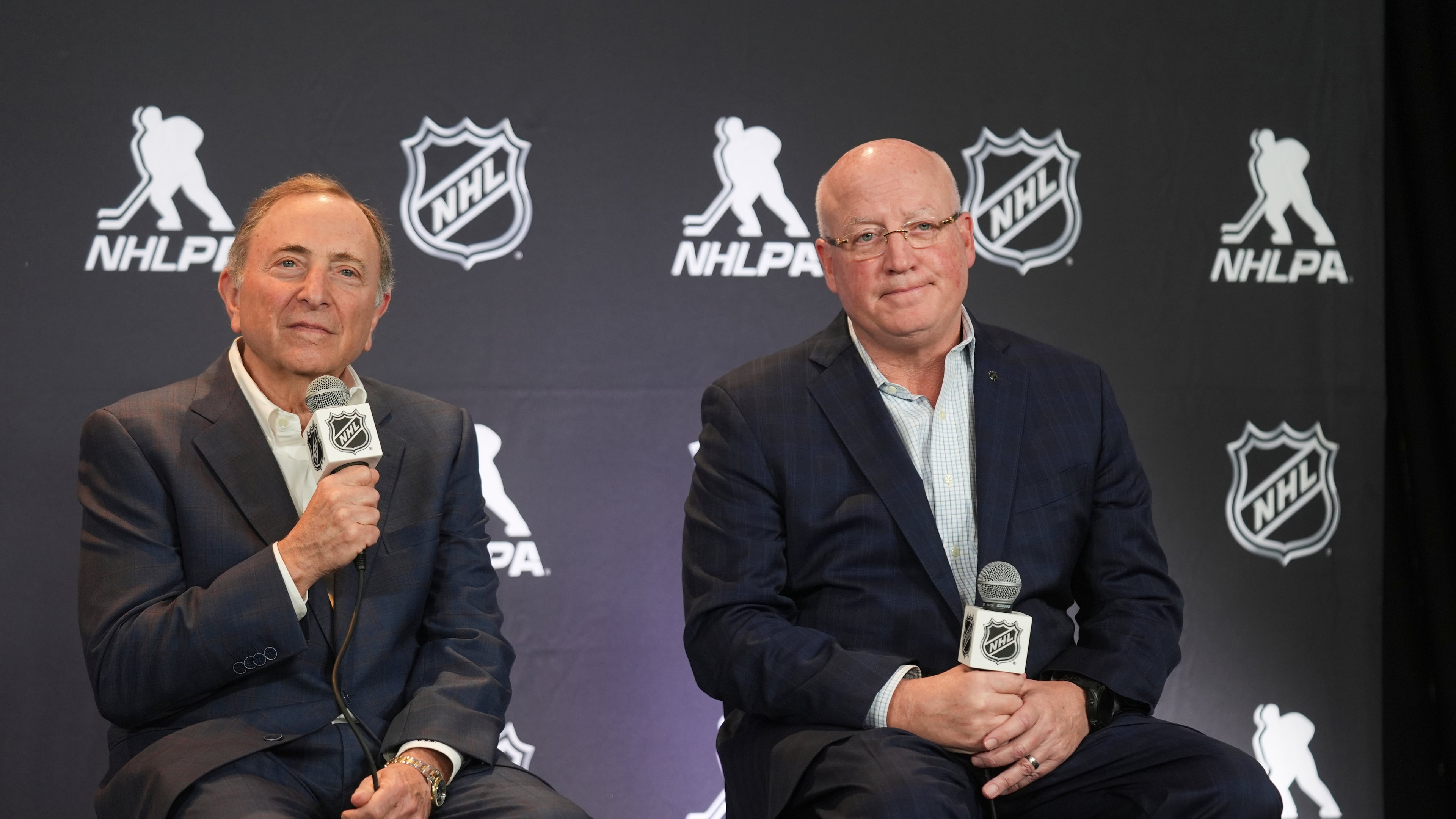 FILE - NHL Commissioner Gary Bettman, left, and Bill Daly, NHL Deputy Commissioner, conduct a joint news conference before the NHL hockey draft on June 27, 2025, in Los Angeles. (AP Photo/Damian Dovarganes, File)