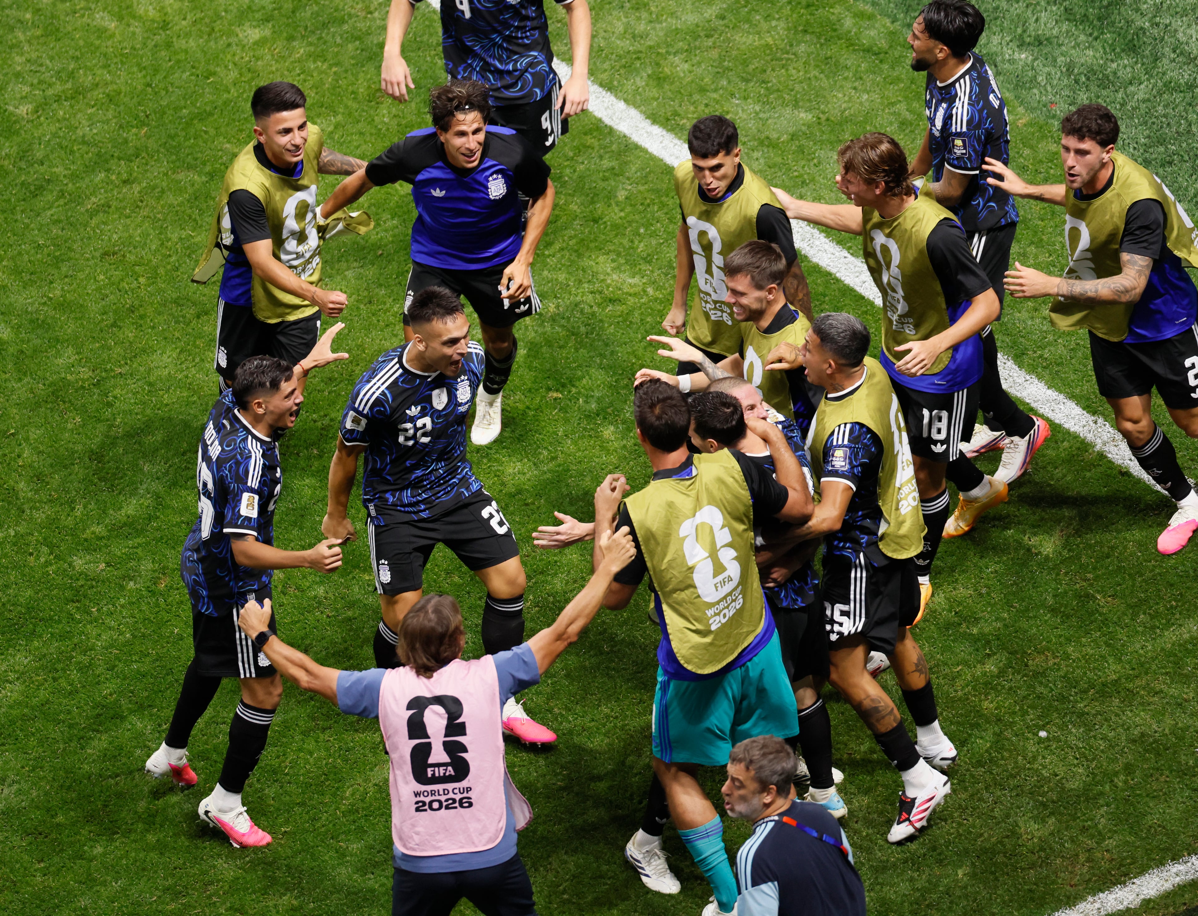 Argentina's Lautaro Martinez, (22), is mobbed by teammates after the winning goal during second half of Argentina vs. England FIFA World Cup Semifinal match at Atlanta Stadium (Mercedes-Benz Stadium) on Wednesday, July 15, 2026. (Miguel Martinez/AJC)