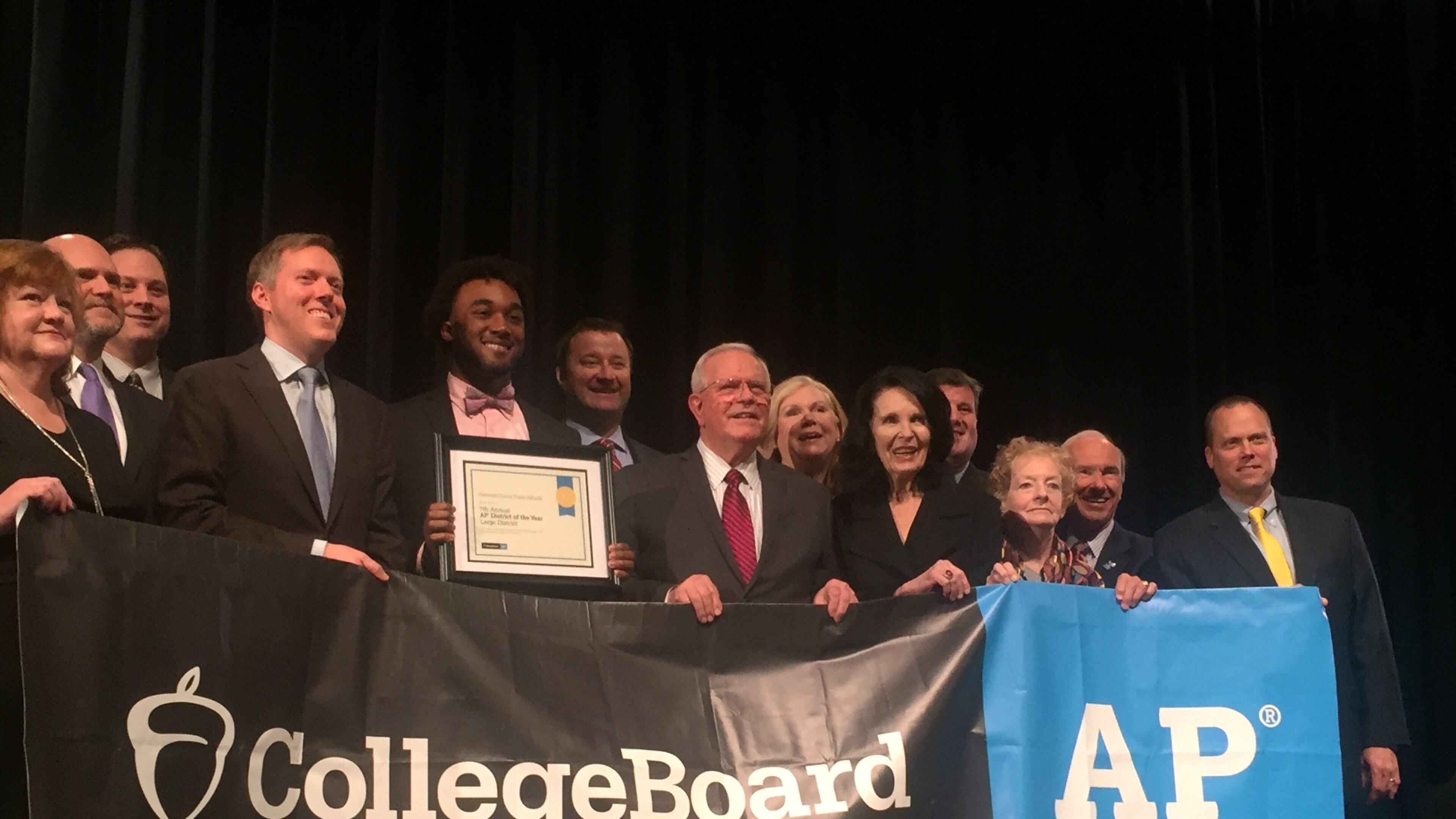 Gwinnett County school district and College Board officials pose for photos after a ceremony at Duluth High School on Feb. 21, 2017 in which the board named Gwinnett its Advanced Placement District of the Year among the nation's largest school districts. ERIC STIRGUS/ESTIRGUS@AJC.COM