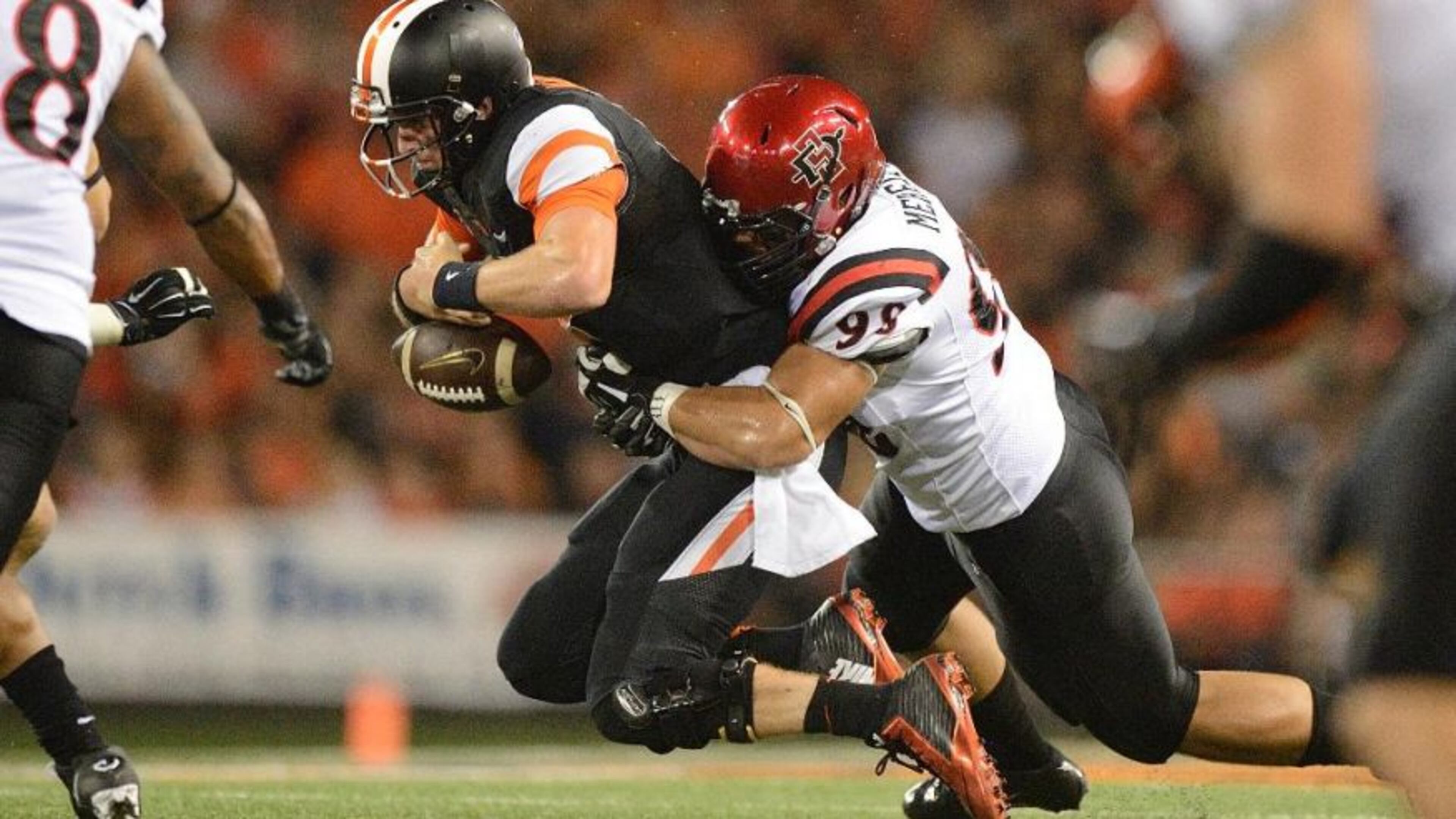 Oregon State tailback Terron Ward (28) scores a touchdown against San Diego State with Sam Meredith trying to make the stop during the second quarter of an NCAA college football game in Corvallis, Ore., Saturday, Sept. 20, 2014. (AP Photo/Troy Wayrynen) (The Associated Press)