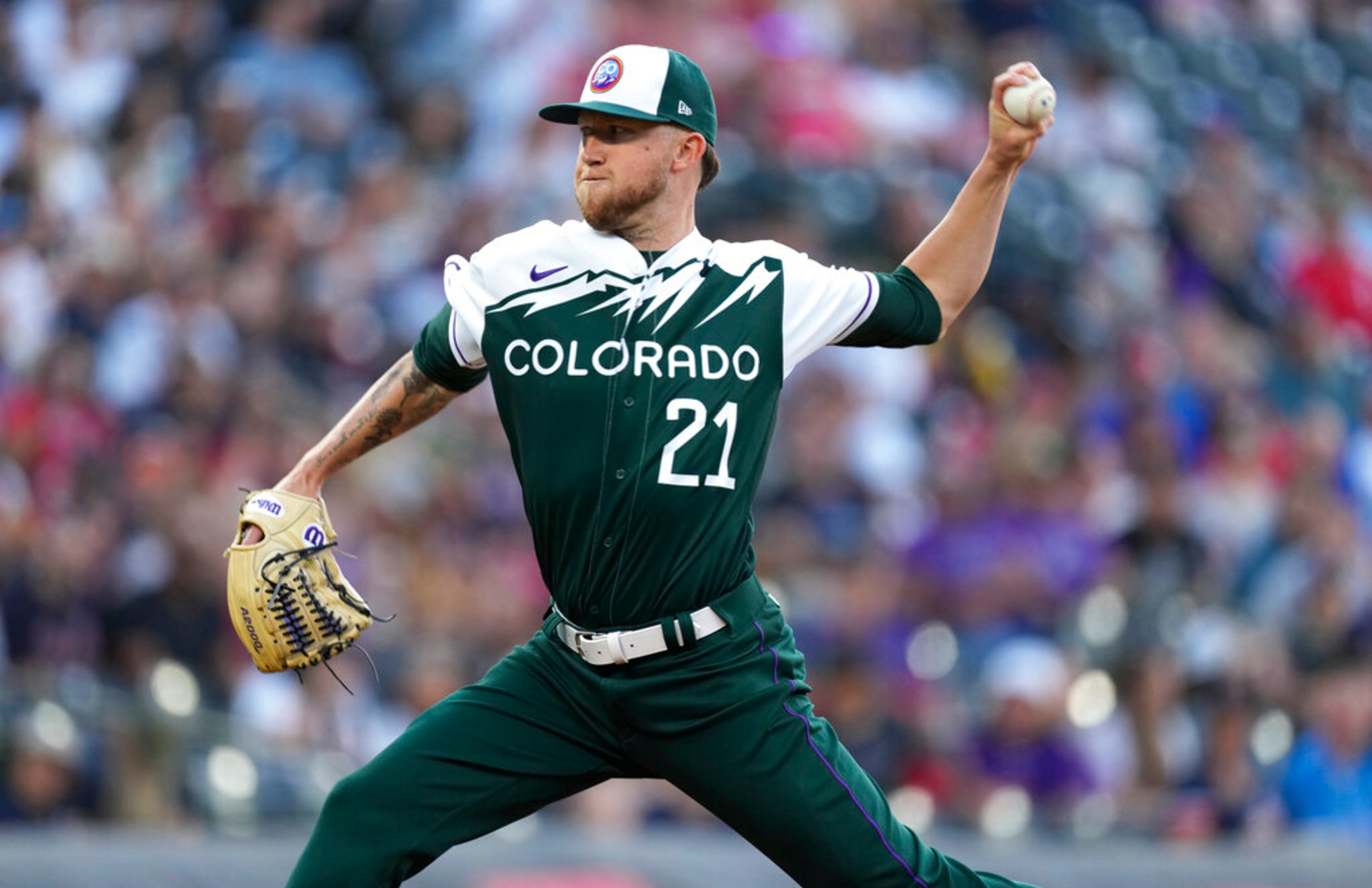Colorado Rockies starting pitcher Kyle Freeland works against the Atlanta Braves during the first inning of a baseball game Saturday, June 4, 2022, in Denver. (AP Photo/David Zalubowski)