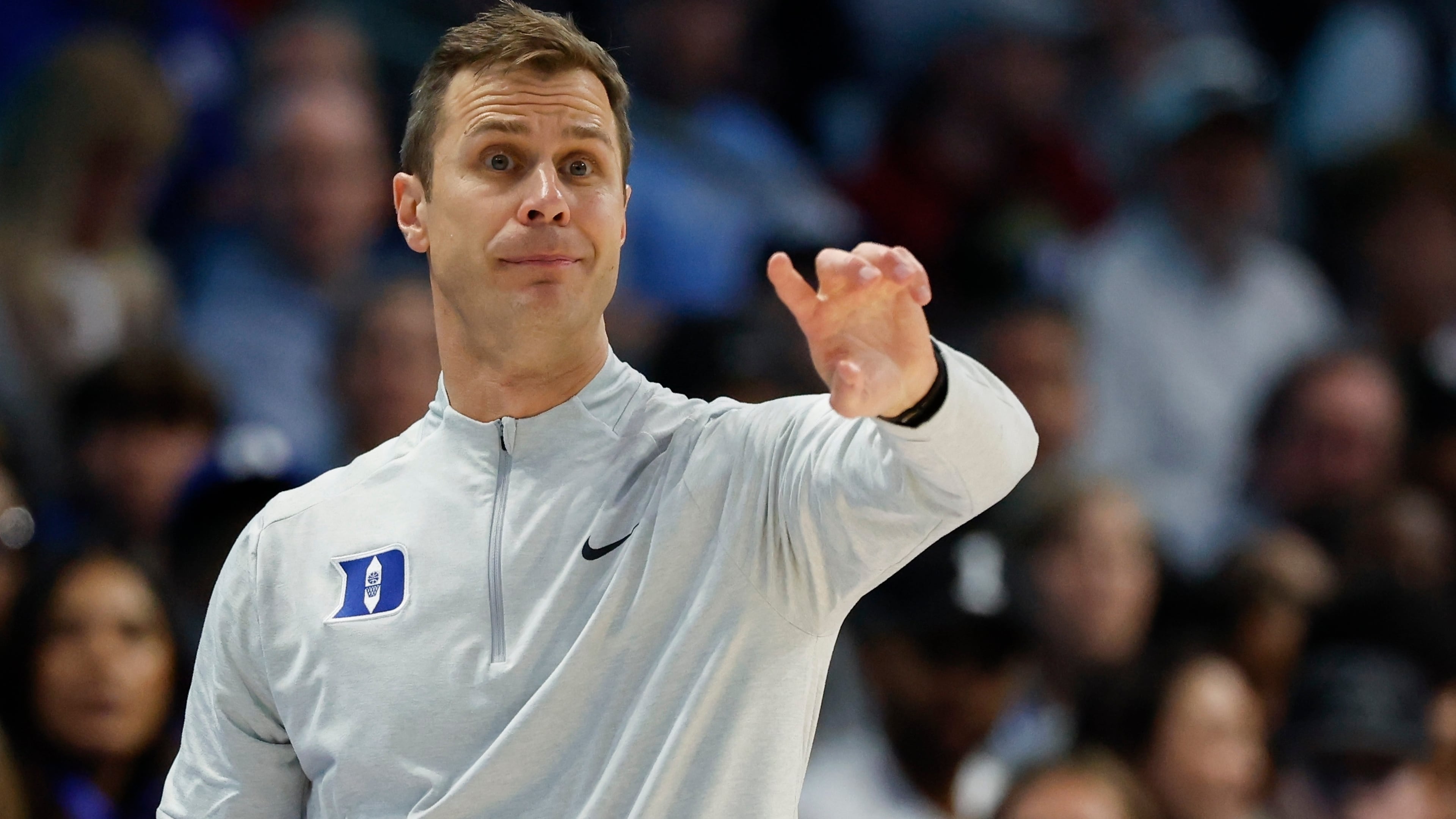 Duke head coach Jon Scheyer directs his team against Florida State during the second half of an NCAA college basketball game in the quarterfinals of the Atlantic Coast Conference tournament in Charlotte, N.C., Thursday, March 12, 2026. (AP Photo/Nell Redmond)